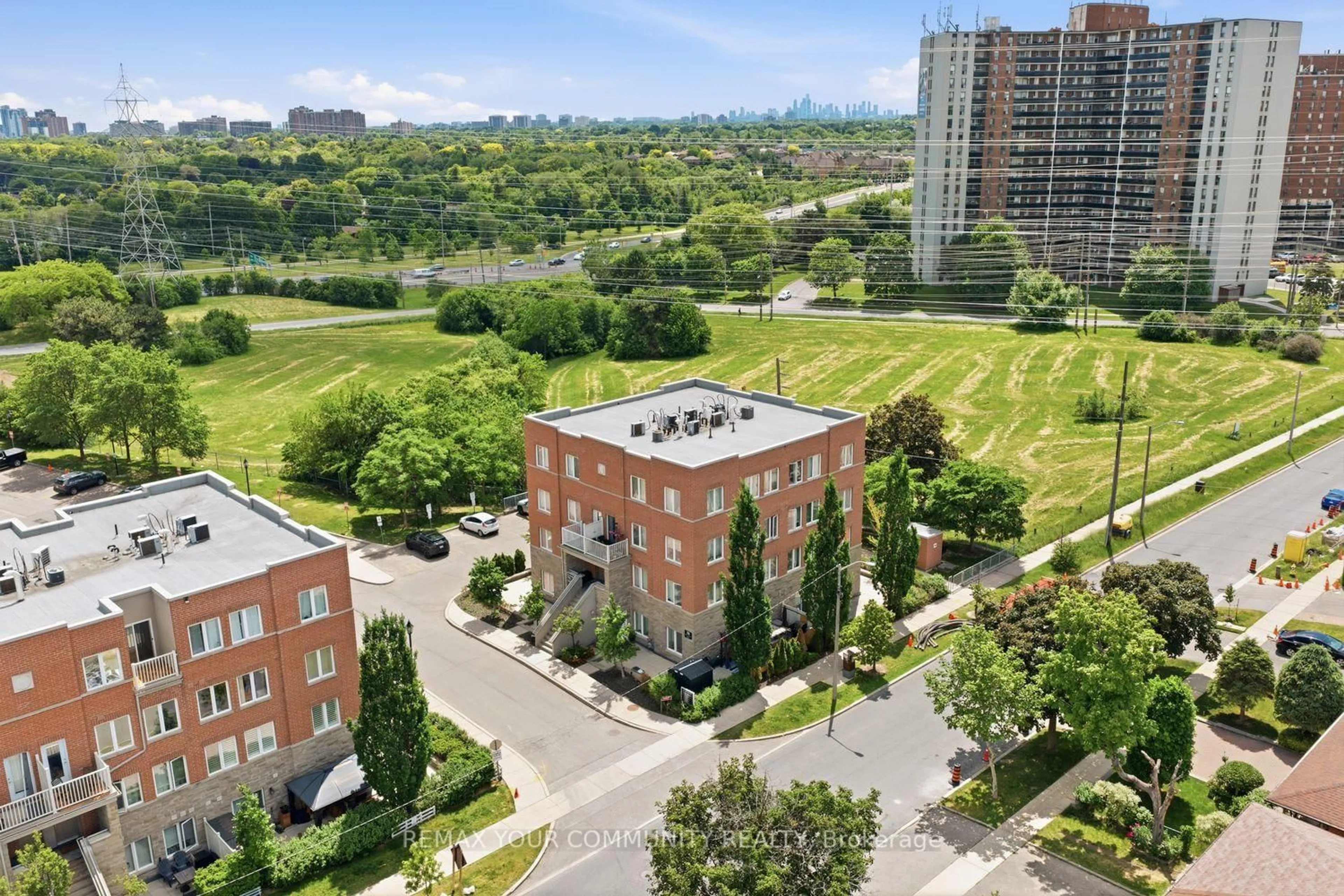 A pic from outside/outdoor area/front of a property/back of a property/a pic from drone, city buildings view from balcony for 35 Richgrove Dr #204, Toronto Ontario M9R 0A3