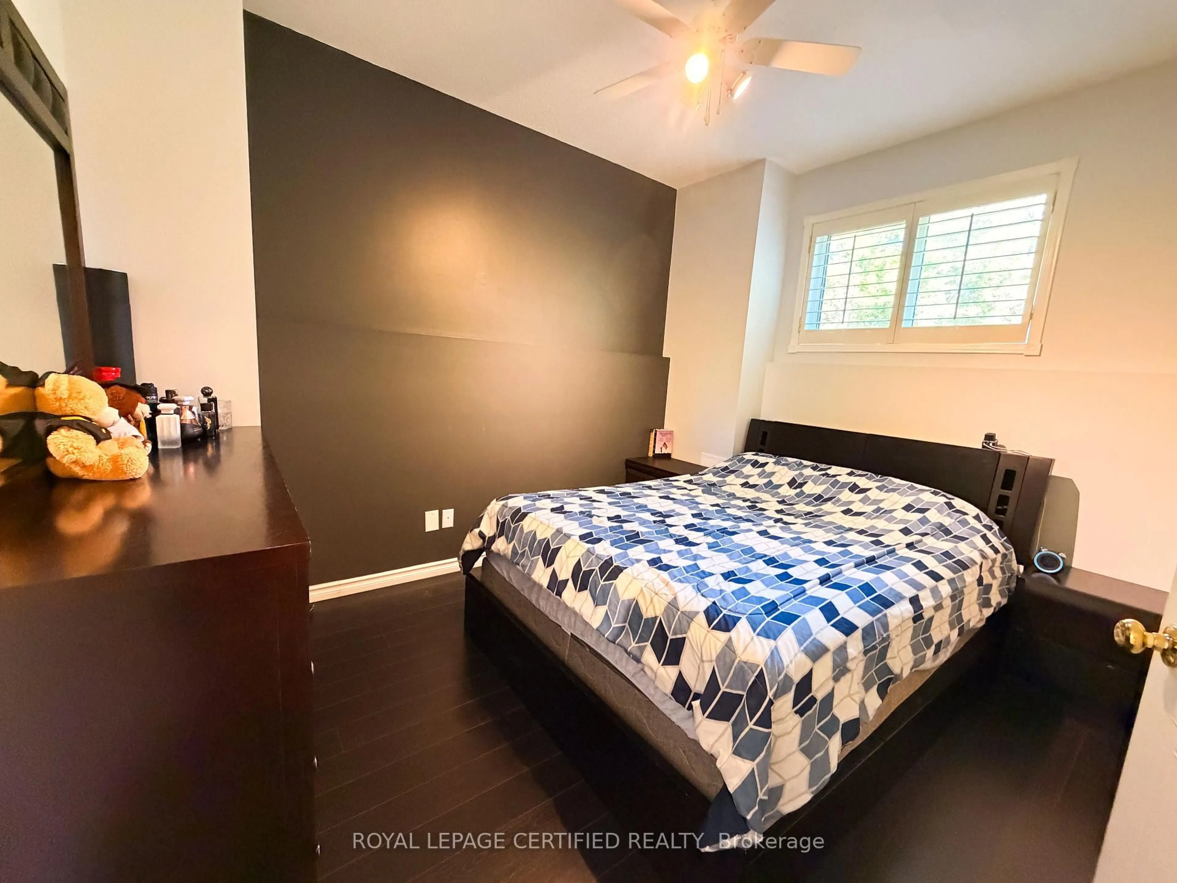 Bedroom with bed, wood/laminate floor for 7349 Zinnia Pl, Mississauga Ontario L5W 1K6
