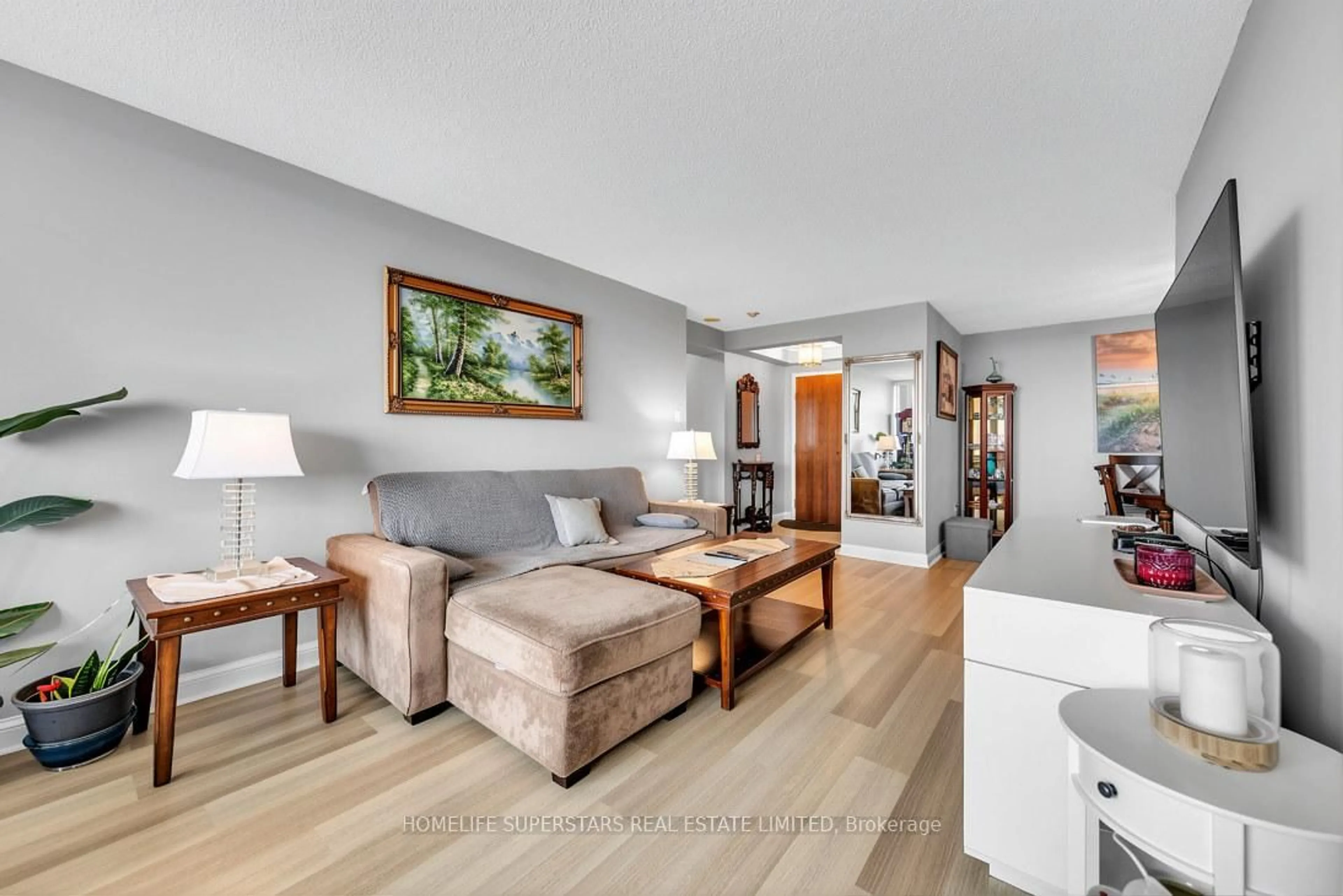 Living room with furniture, wood/laminate floor for 24 Hanover Rd #907, Brampton Ontario L6S 5K8
