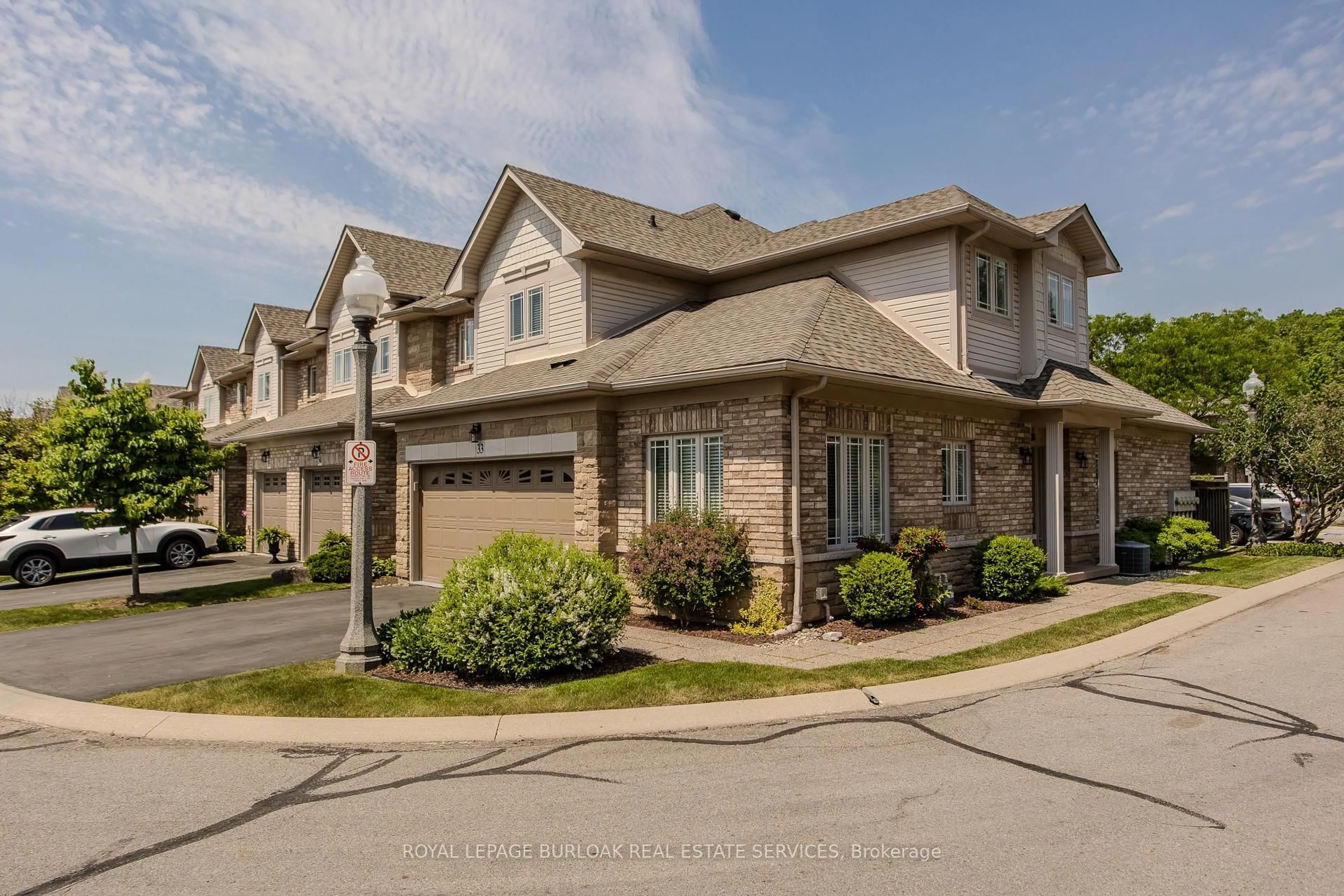 Home with brick exterior material, street for 2169 Orchard Rd #33, Burlington Ontario L7L 7J1