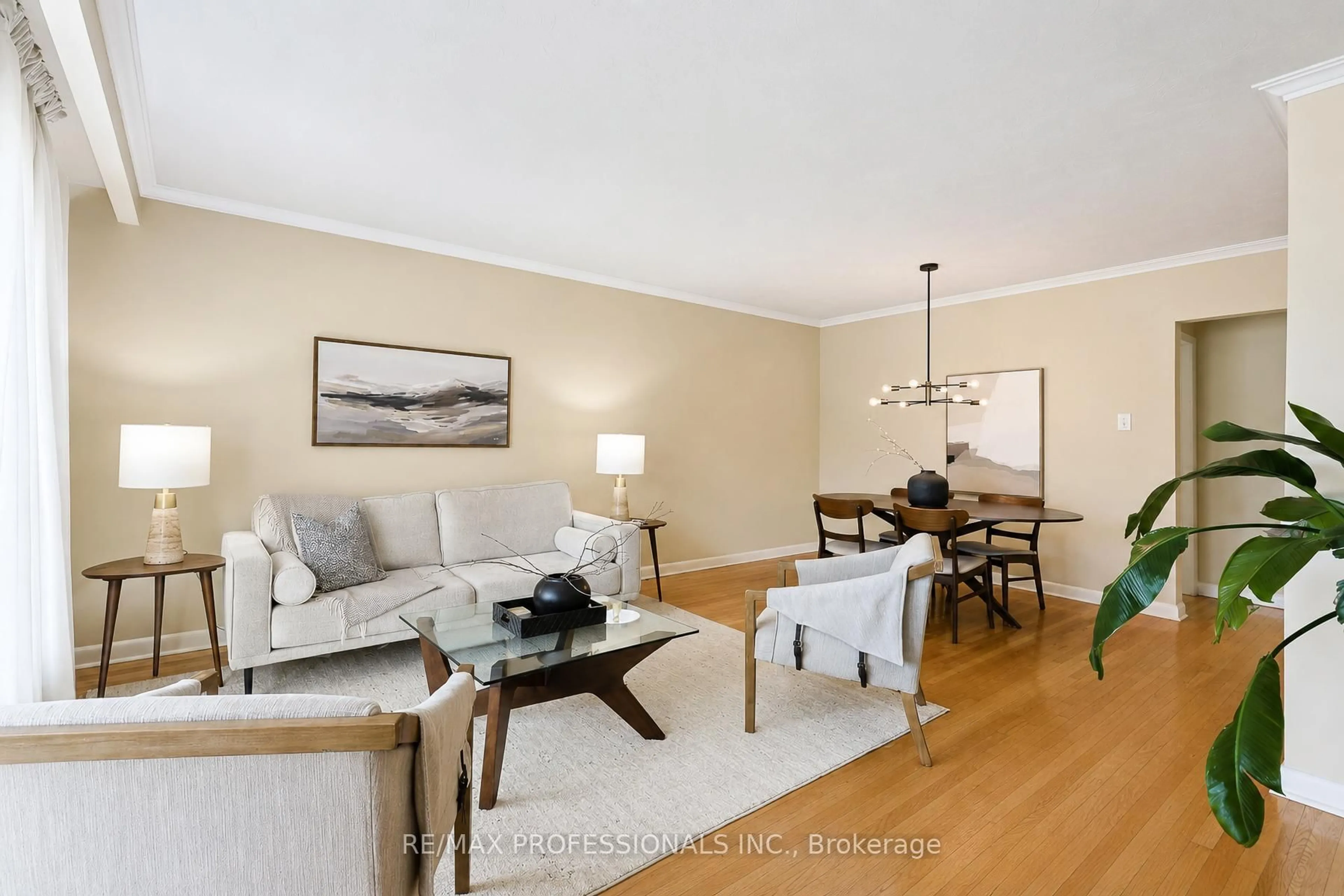 Living room with furniture, wood/laminate floor for 3 Embers Dr, Toronto Ontario M9C 3E4