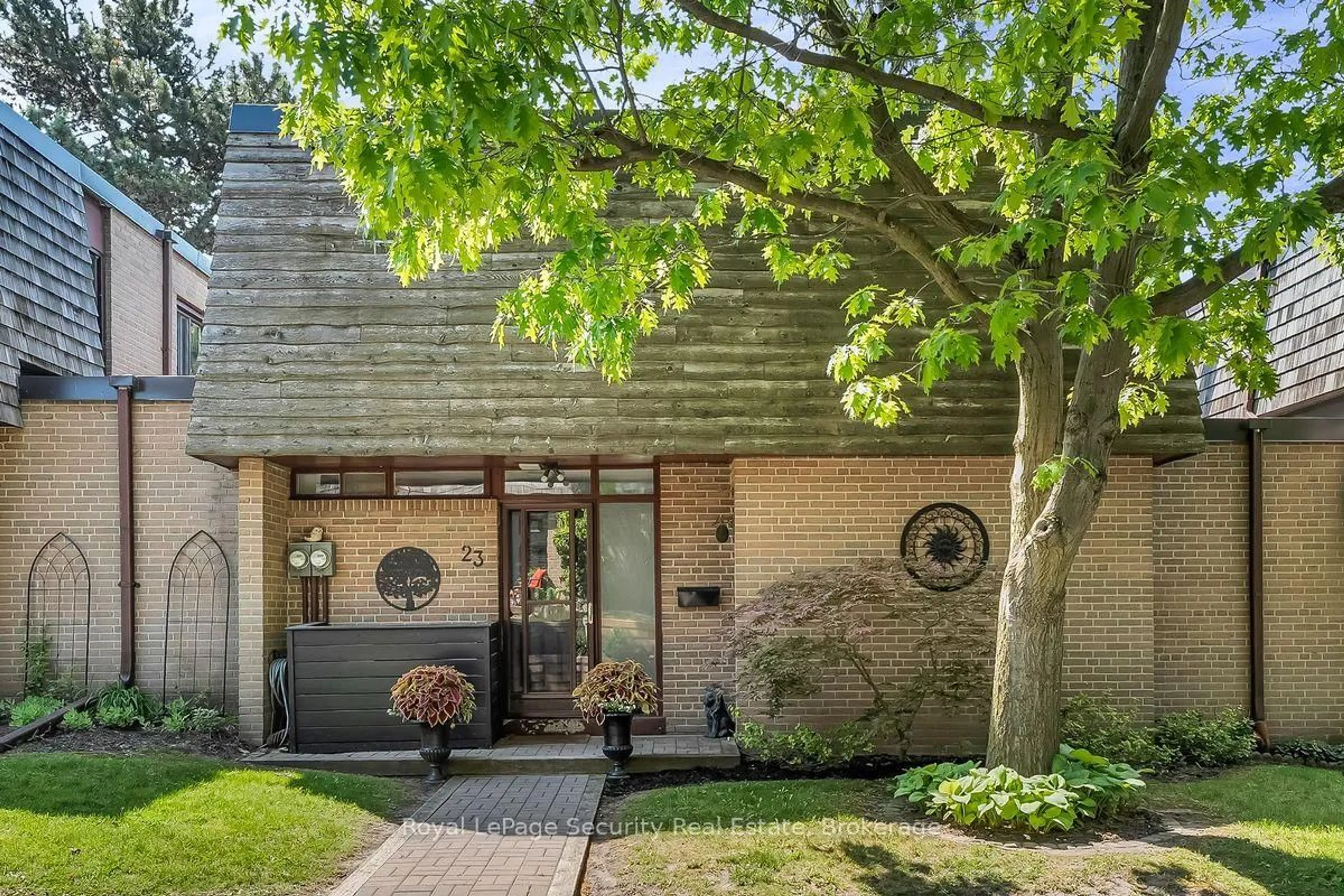 Home with brick exterior material, street for 23 Raintree Path, Toronto Ontario M9C 5A9
