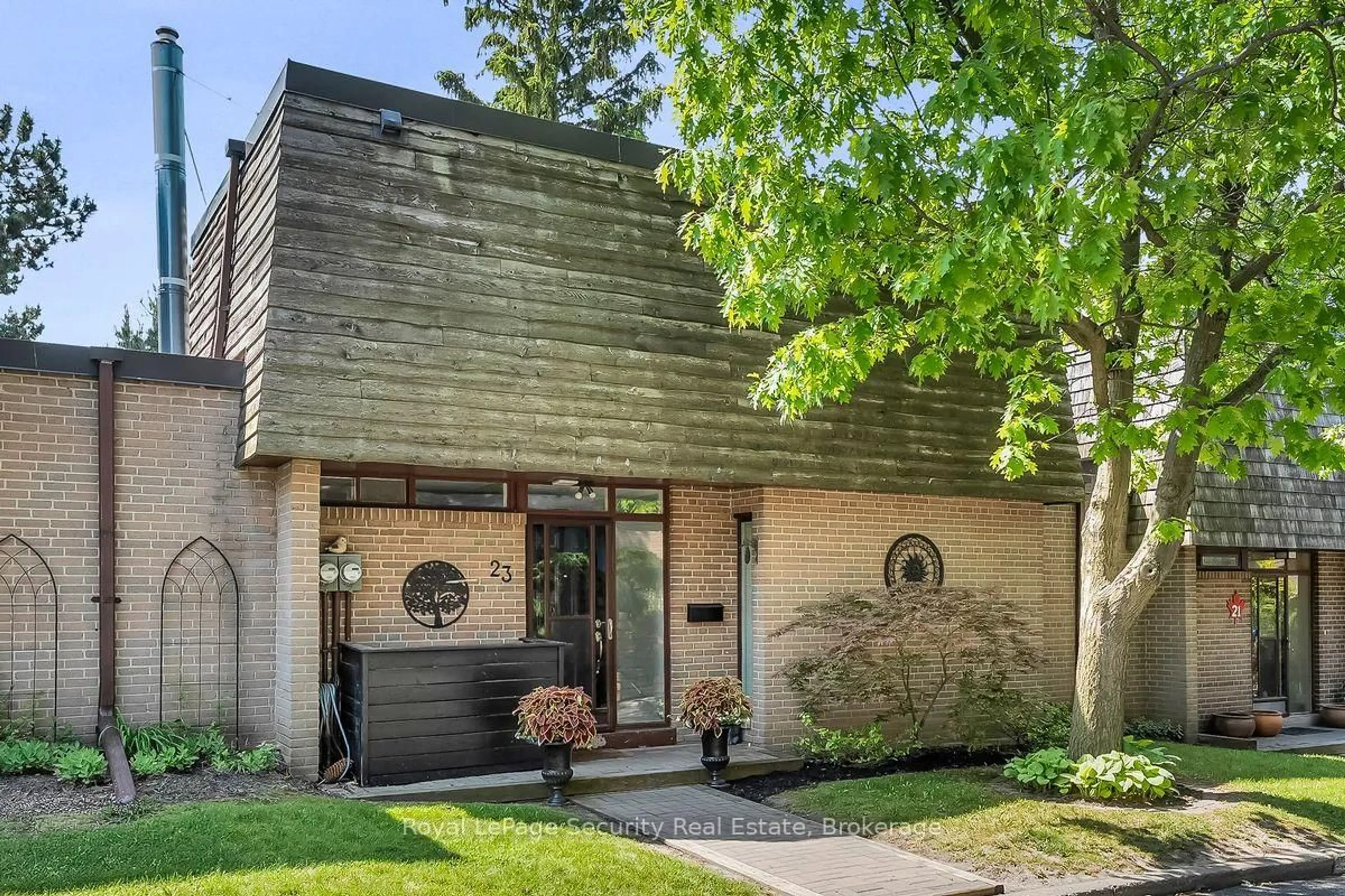 Home with brick exterior material, street for 23 Raintree Path, Toronto Ontario M9C 5A9