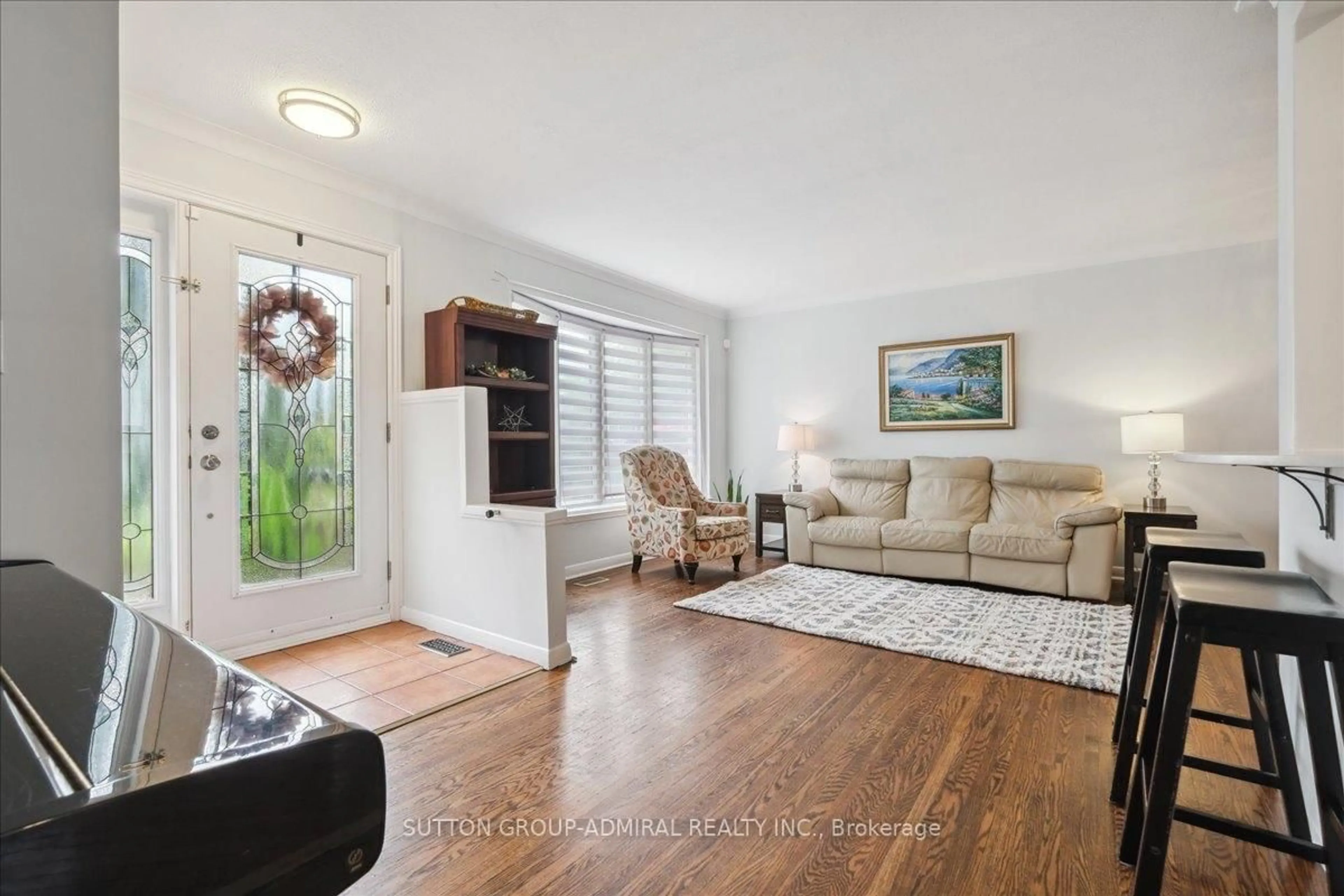 Living room with furniture, wood/laminate floor for 1864 Hindhead Rd, Mississauga Ontario L5J 1N6