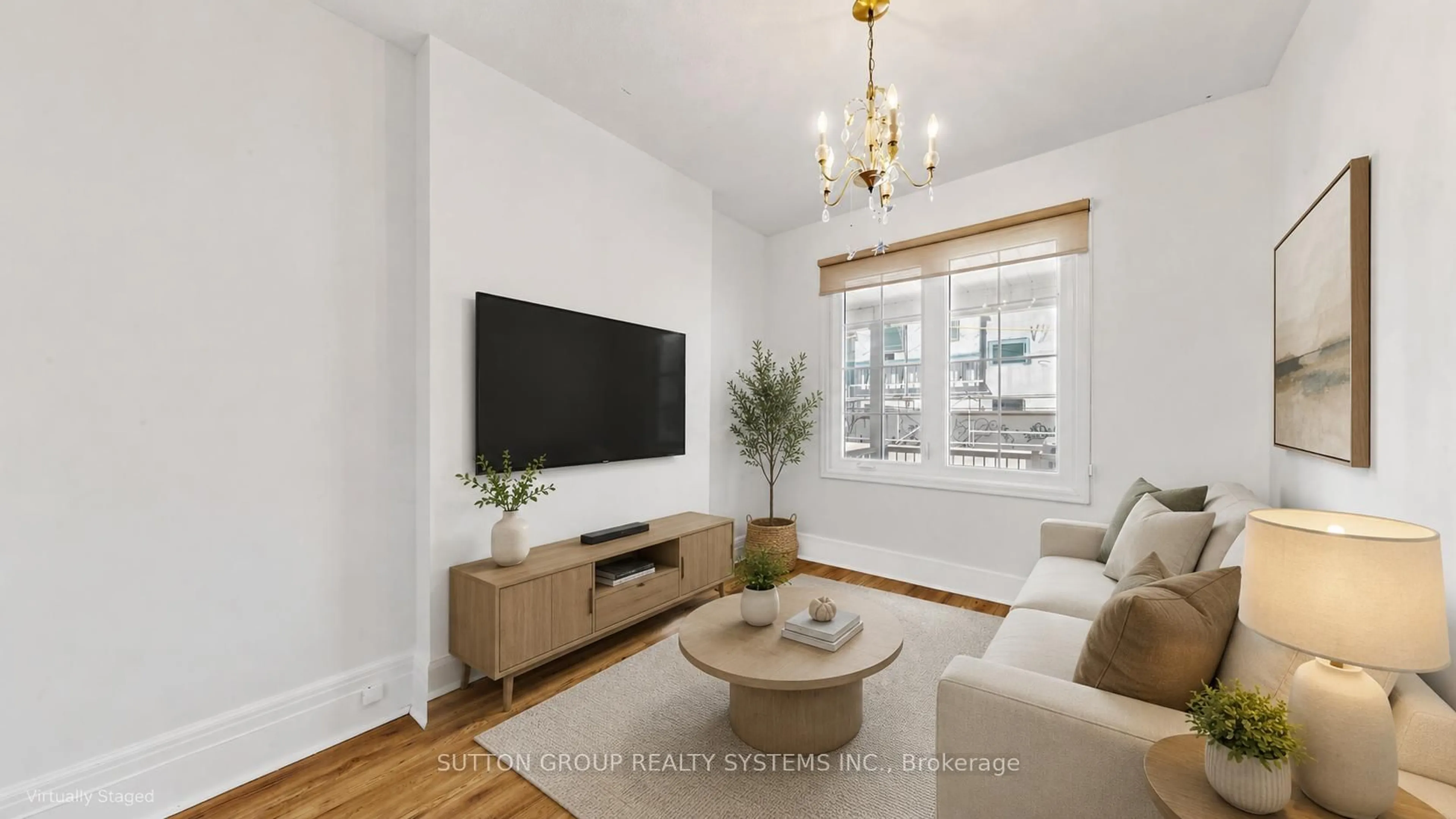 Living room with furniture, wood/laminate floor for 799 Lansdowne Ave, Toronto Ontario M6H 3Z1