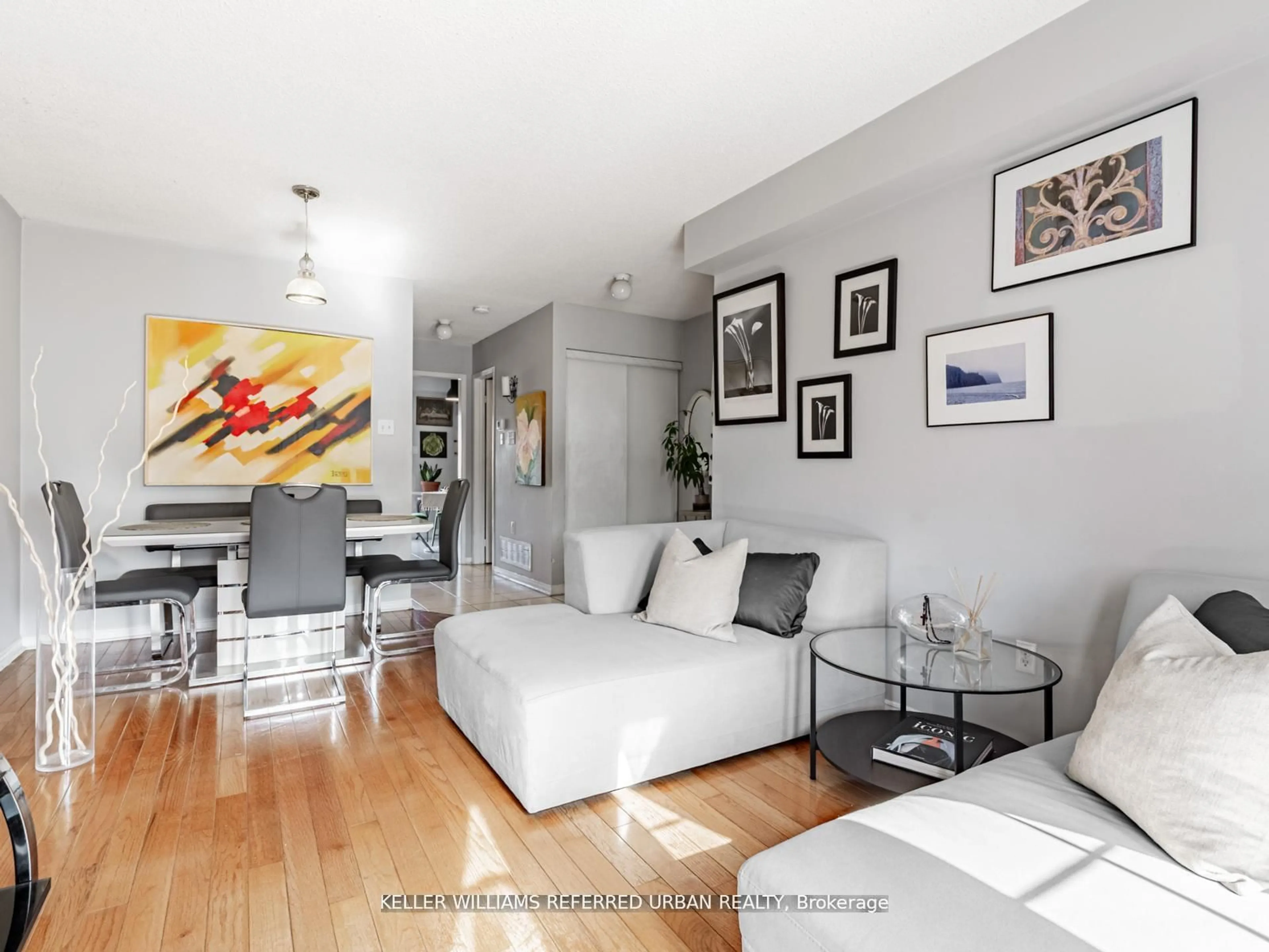 Living room with furniture, wood/laminate floor for 219 Touchstone Dr, Toronto Ontario M6M 5J9