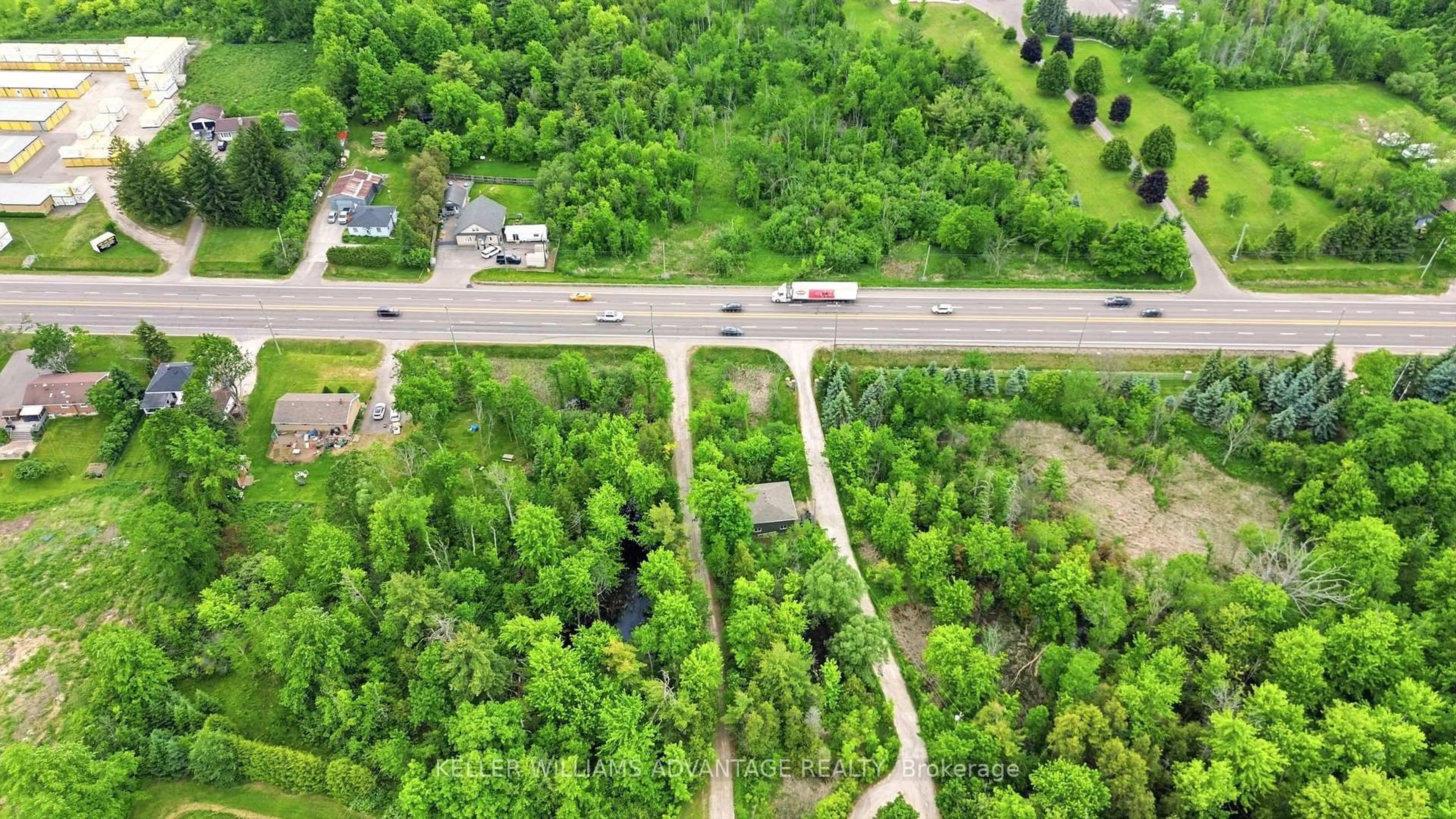 A pic from outside/outdoor area/front of a property/back of a property/a pic from drone, forest/trees view for 13353 Highway 7 W Highway, Halton Hills Ontario L7G 4S4