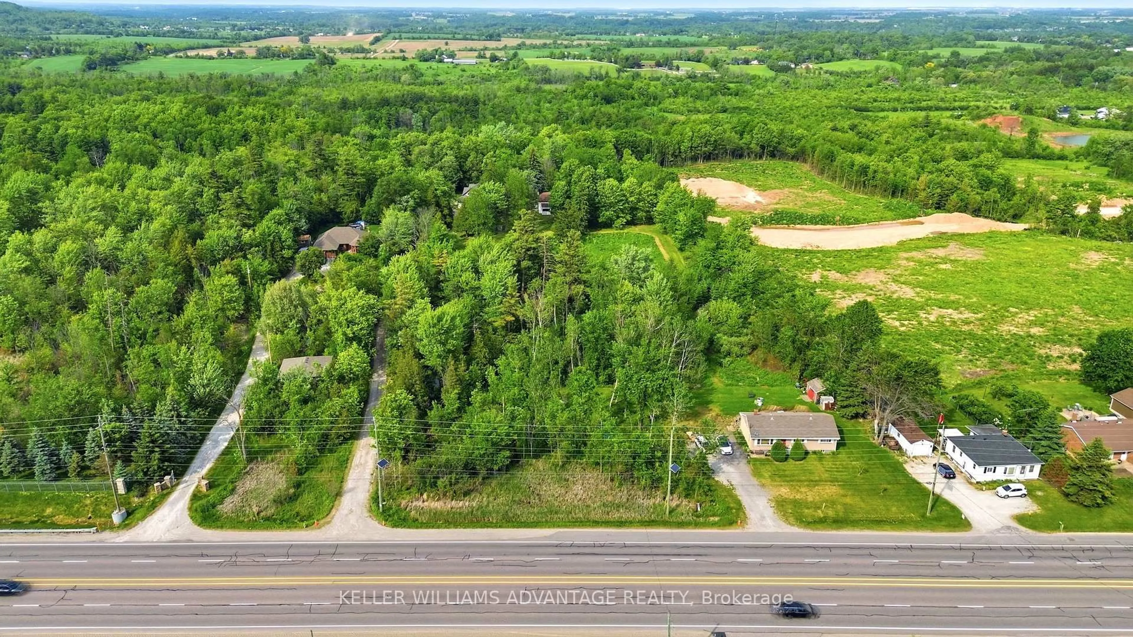 A pic from outside/outdoor area/front of a property/back of a property/a pic from drone, forest/trees view for 13353 Highway 7 W Highway, Halton Hills Ontario L7G 4S4