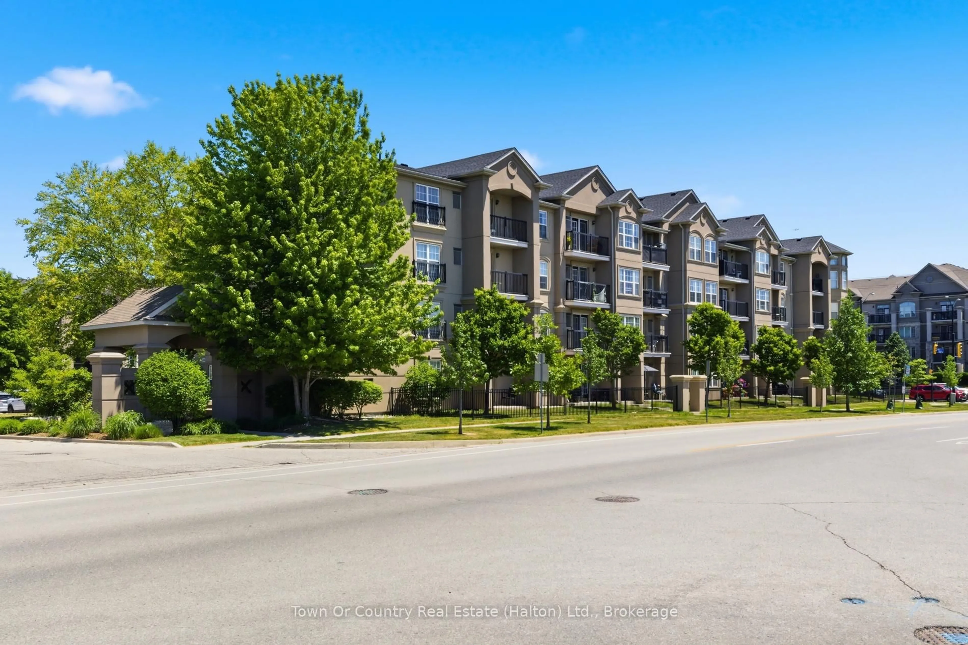 A pic from outside/outdoor area/front of a property/back of a property/a pic from drone, water/lake/river/ocean view for 1487 Maple Ave #403, Milton Ontario L9T 0B7