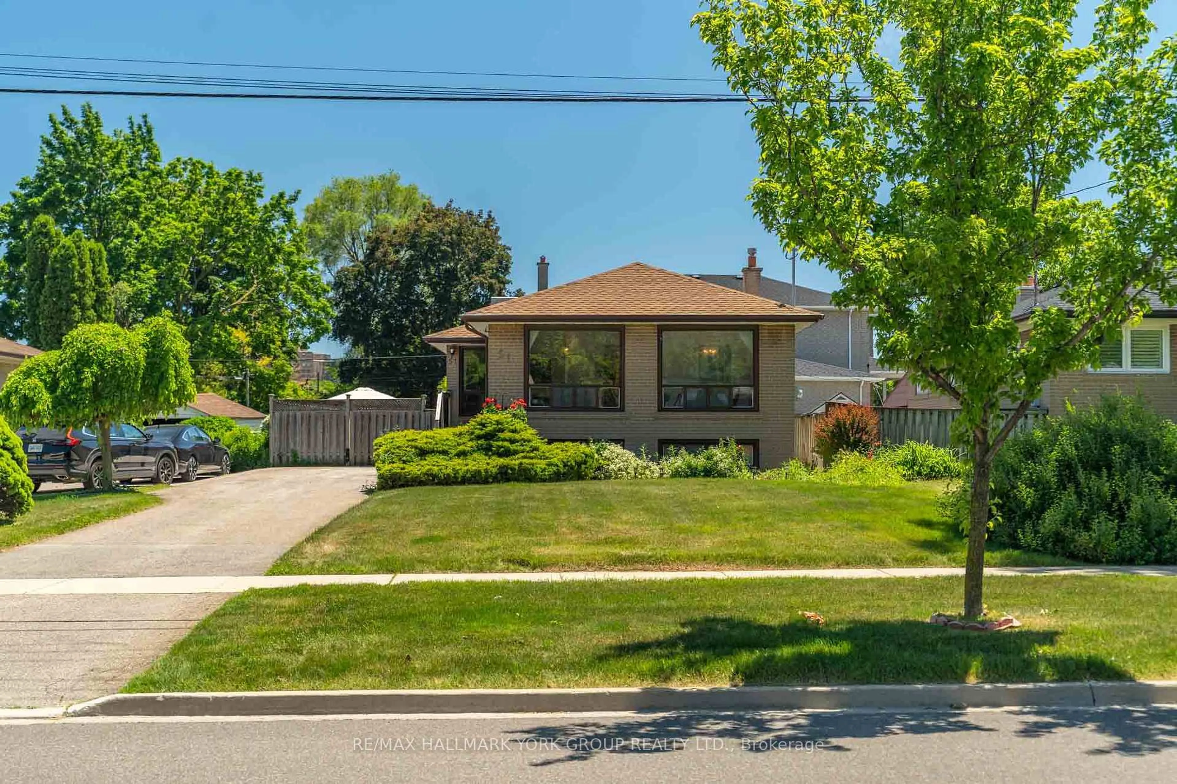 Home with brick exterior material, street for 51 Eringate Dr, Toronto Ontario M9C 3Z2