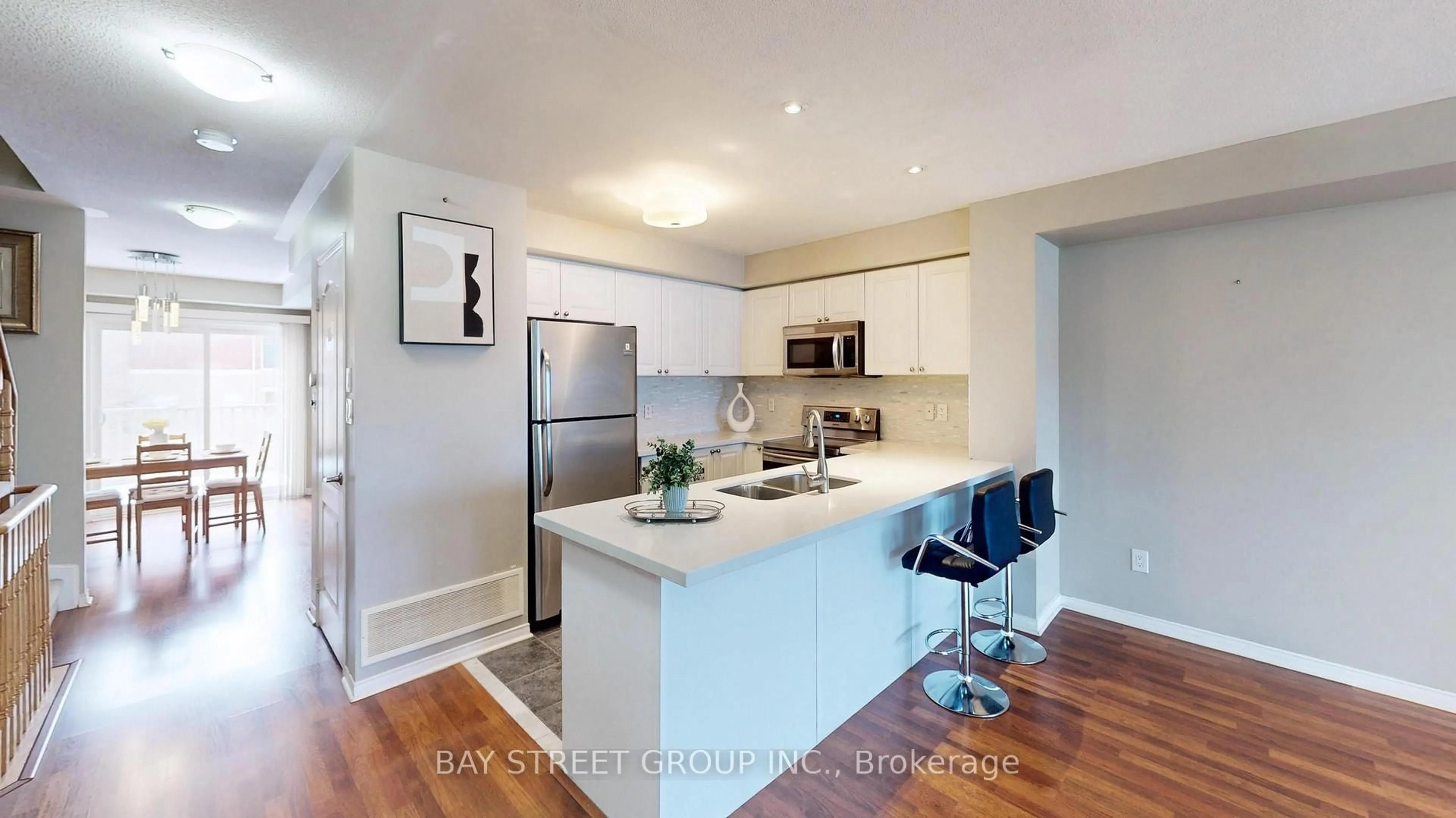 Open concept kitchen, wood/laminate floor for 3975 Eglinton Ave #13, Mississauga Ontario L5M 0E7