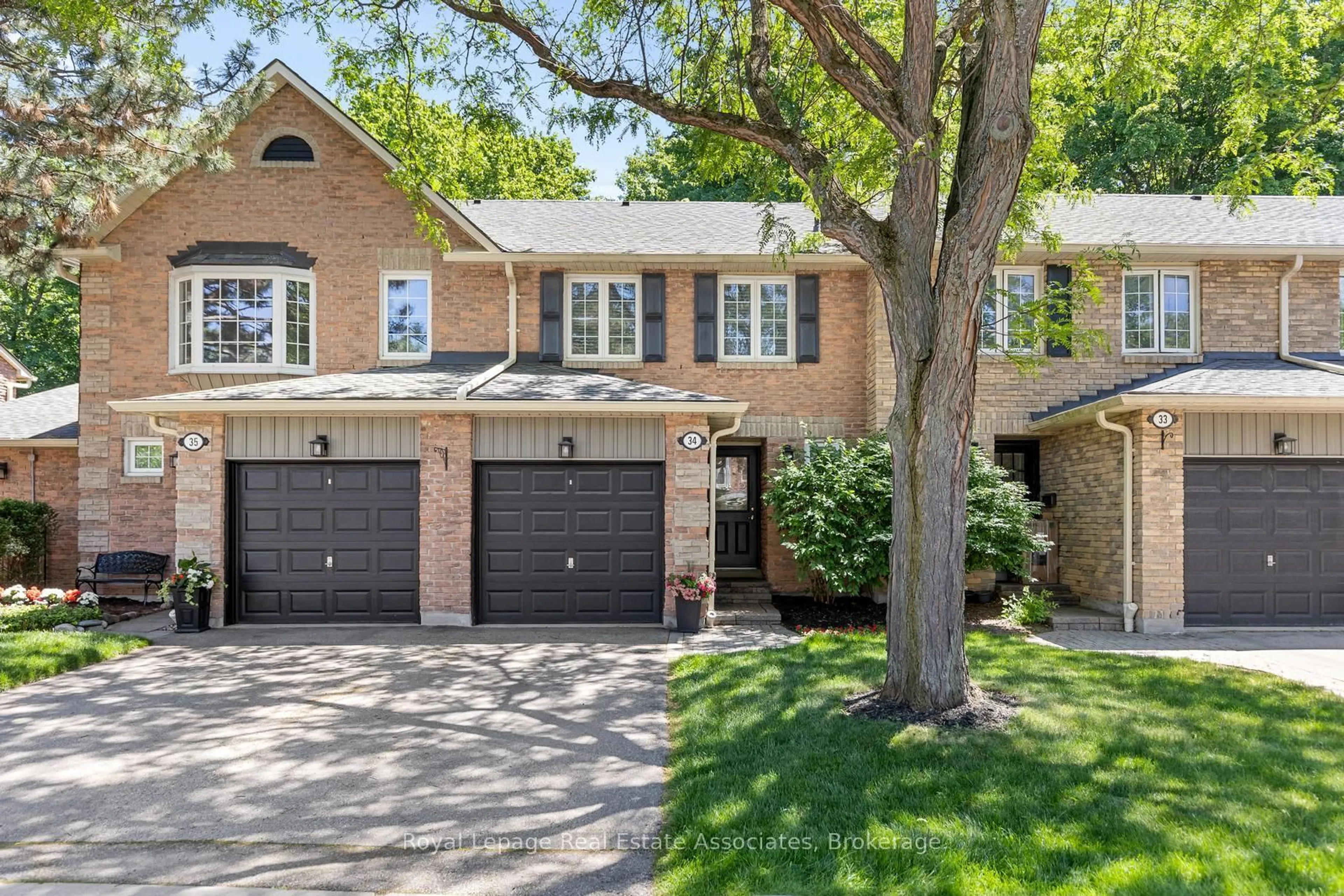 Home with brick exterior material, street for 2766 Folkway Dr #34, Mississauga Ontario L5L 3M3