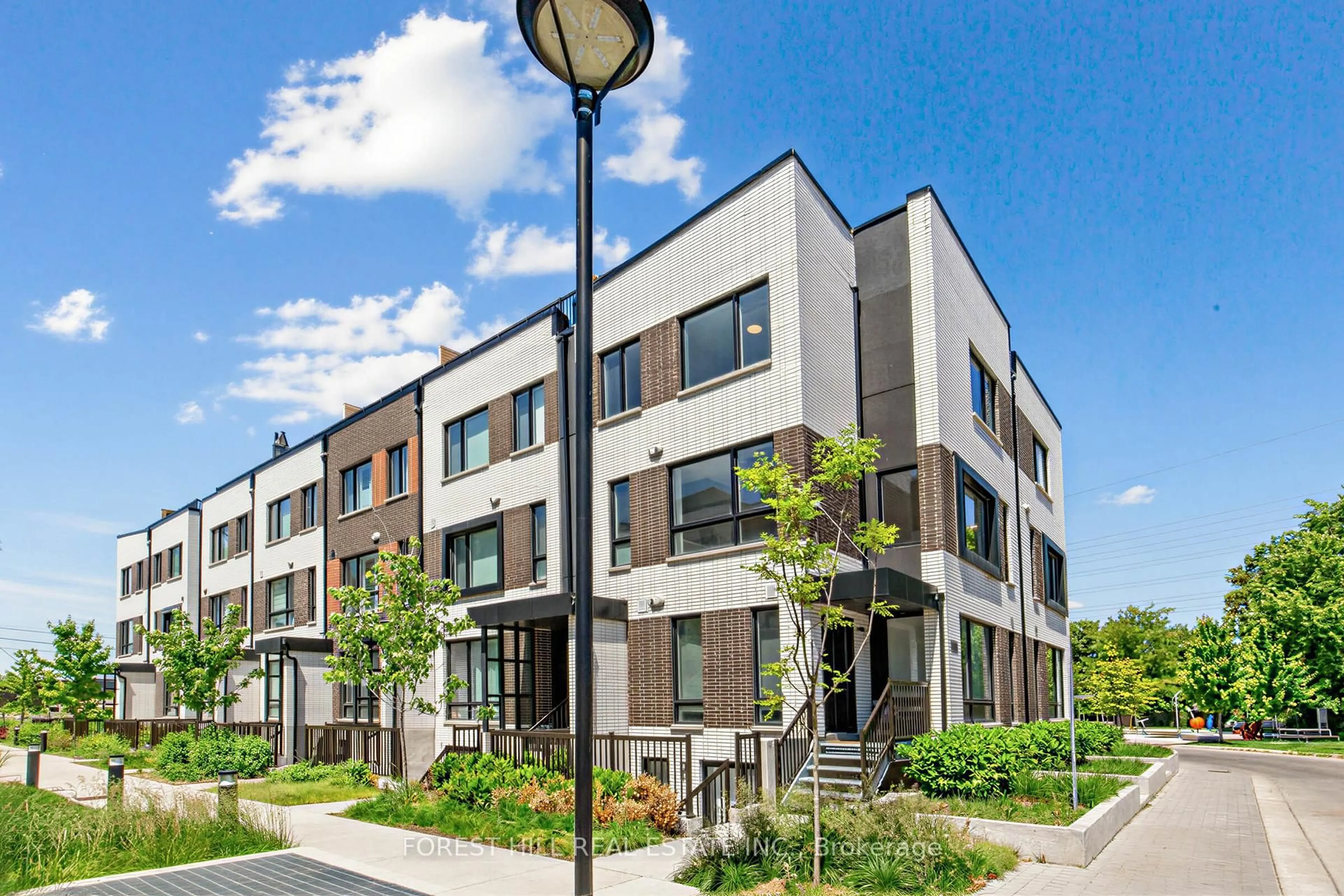 Home with brick exterior material, street for 40 Ed Clark Gdns #2, Toronto Ontario M6N 0B5