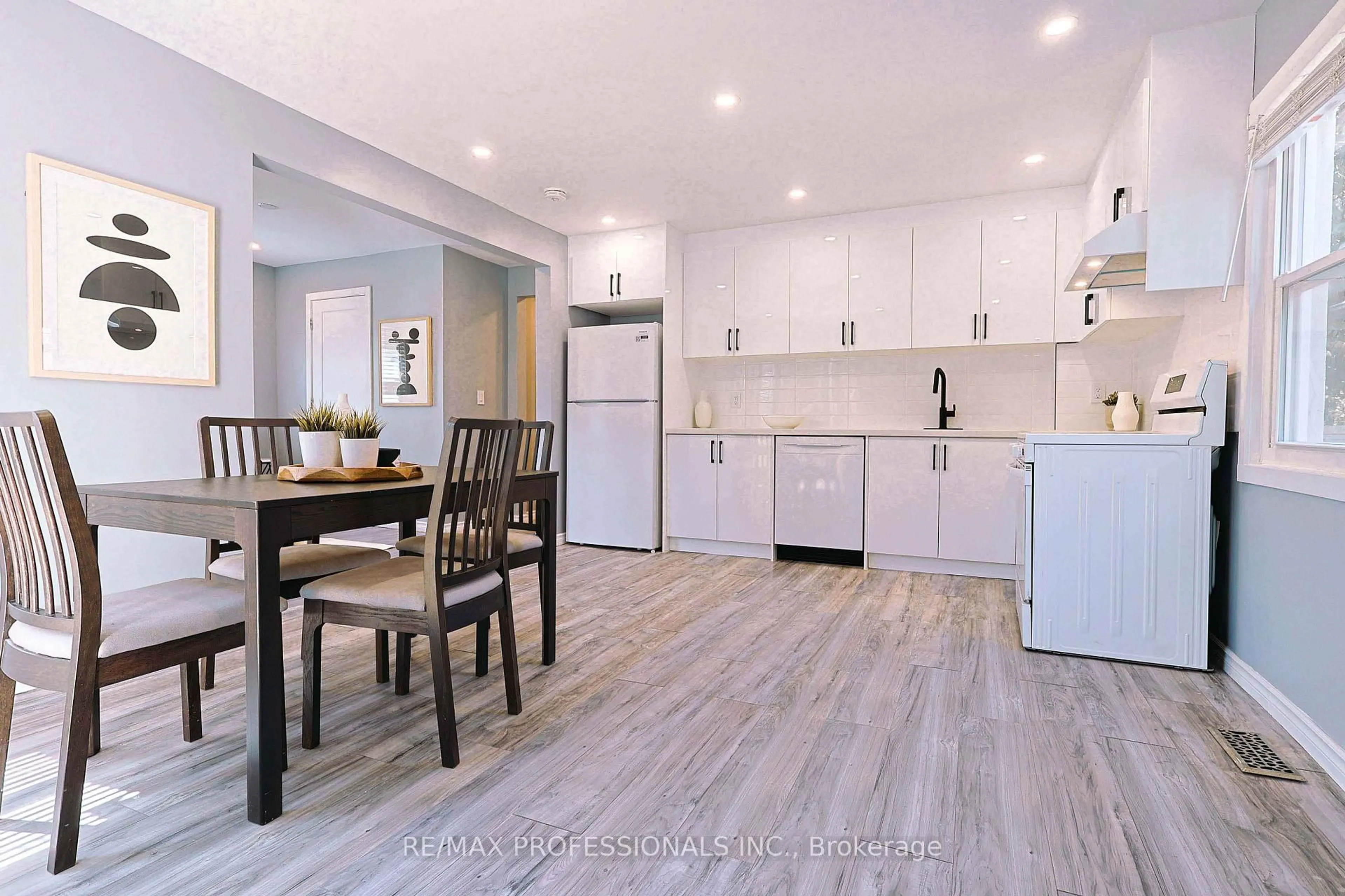 Open concept kitchen, wood/laminate floor for 76 Macdonald St, Toronto Ontario M8V 1Y4