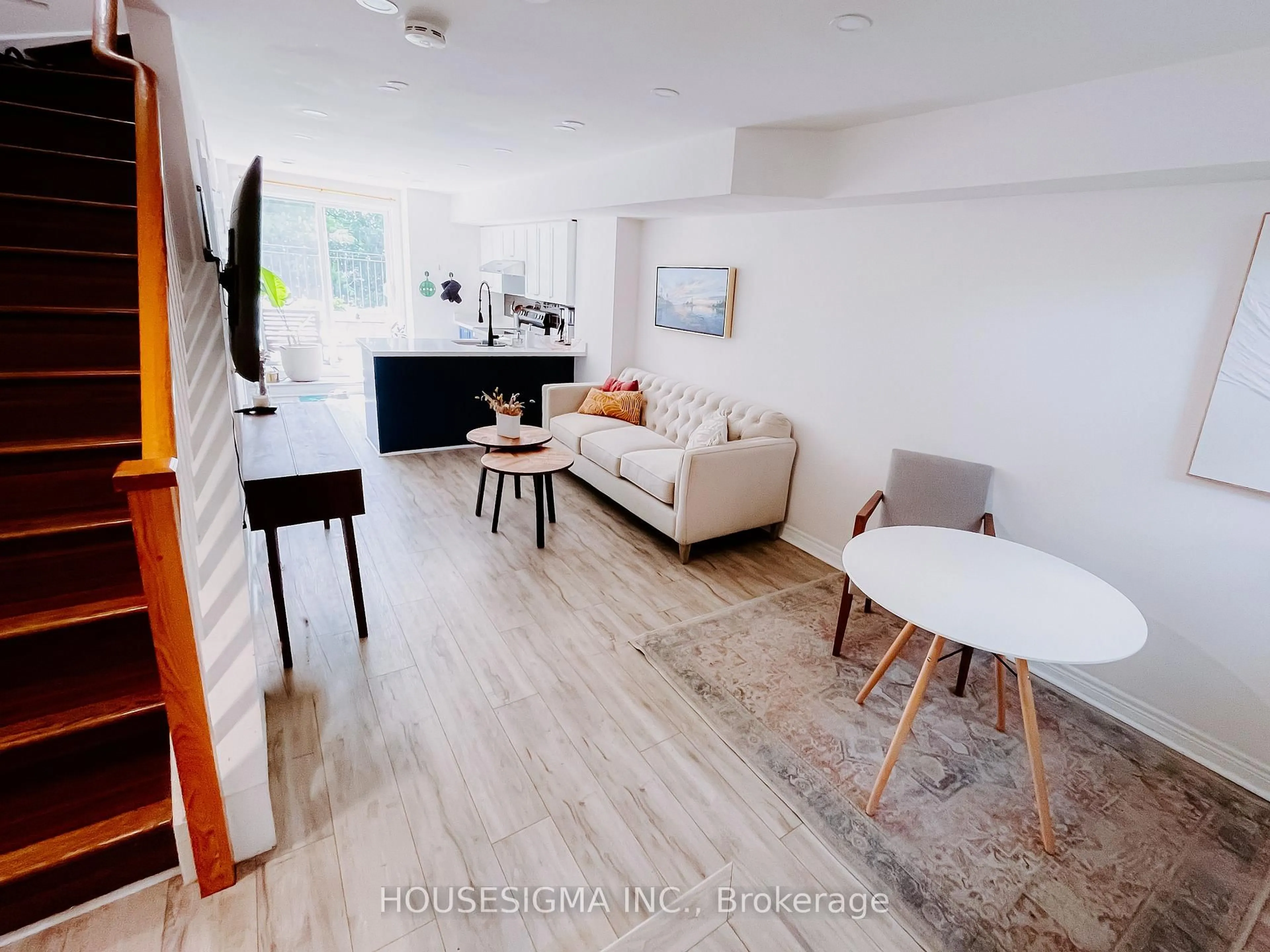 Living room with furniture, wood/laminate floor for 870 Jane St #114, Toronto Ontario M6N 4C2