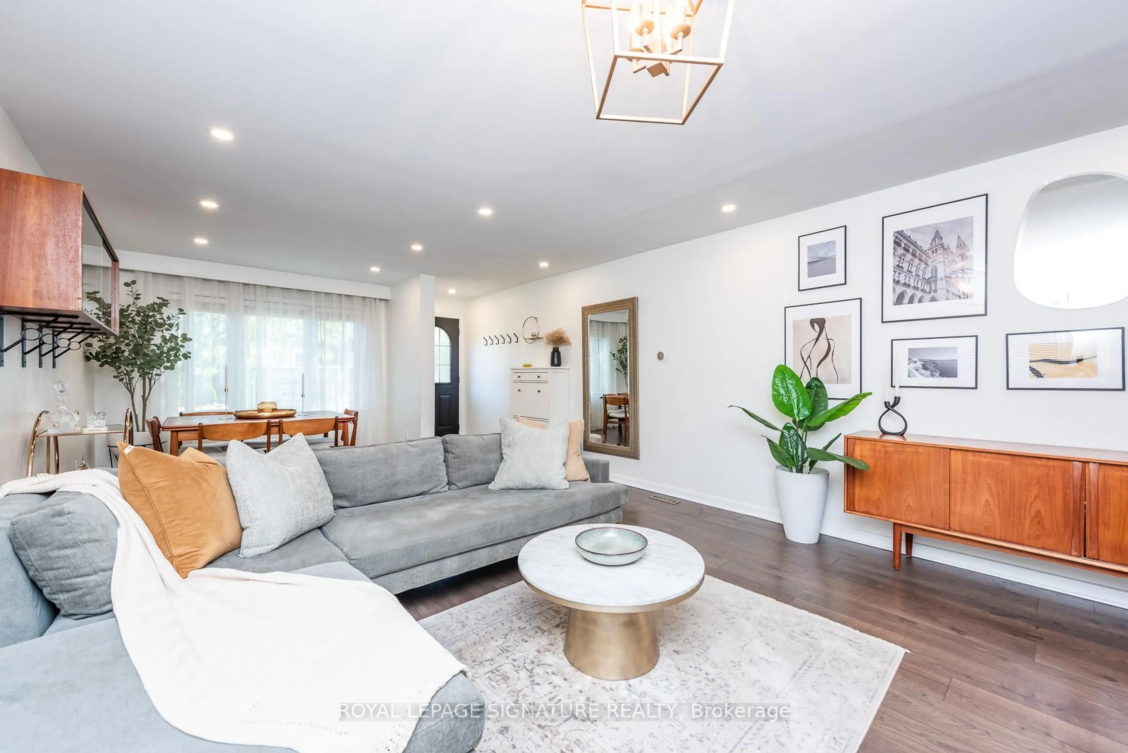 Living room with furniture, wood/laminate floor for 48 McRoberts Ave, Toronto Ontario M6E 4P4