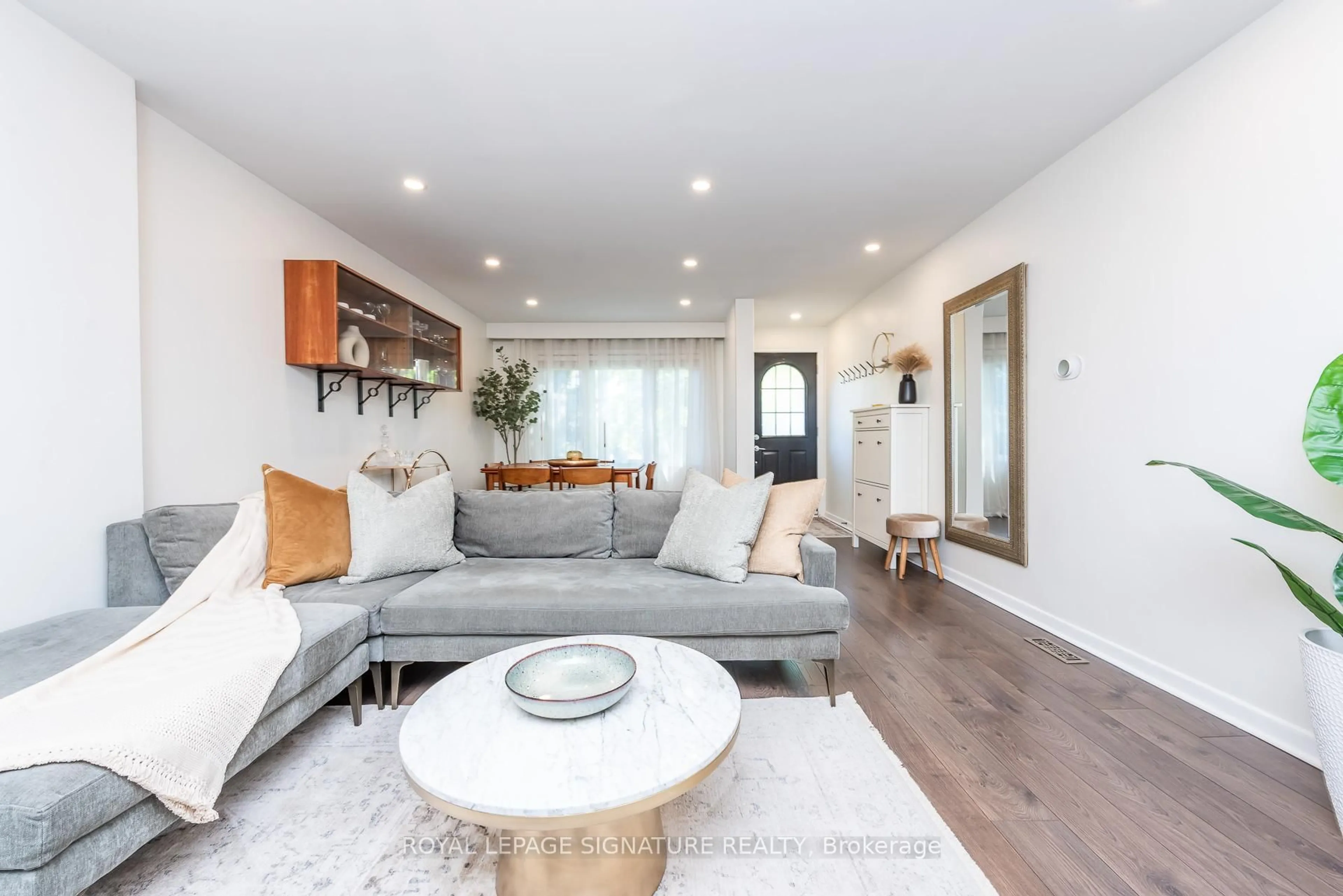 Living room with furniture, wood/laminate floor for 48 McRoberts Ave, Toronto Ontario M6E 4P4