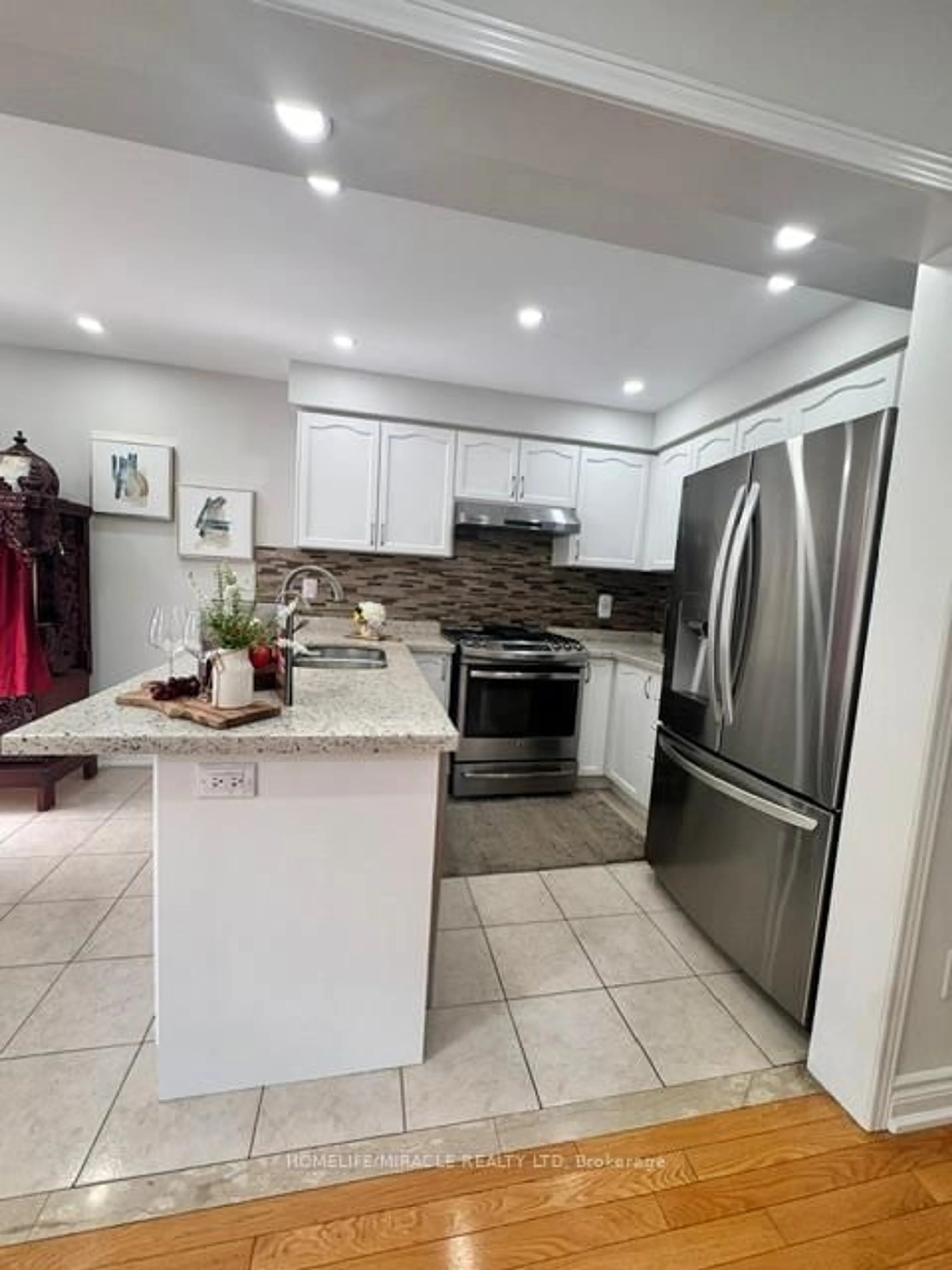 Open concept kitchen, ceramic/tile floor for 65 Bellchase Tr, Brampton Ontario L6P 3L9