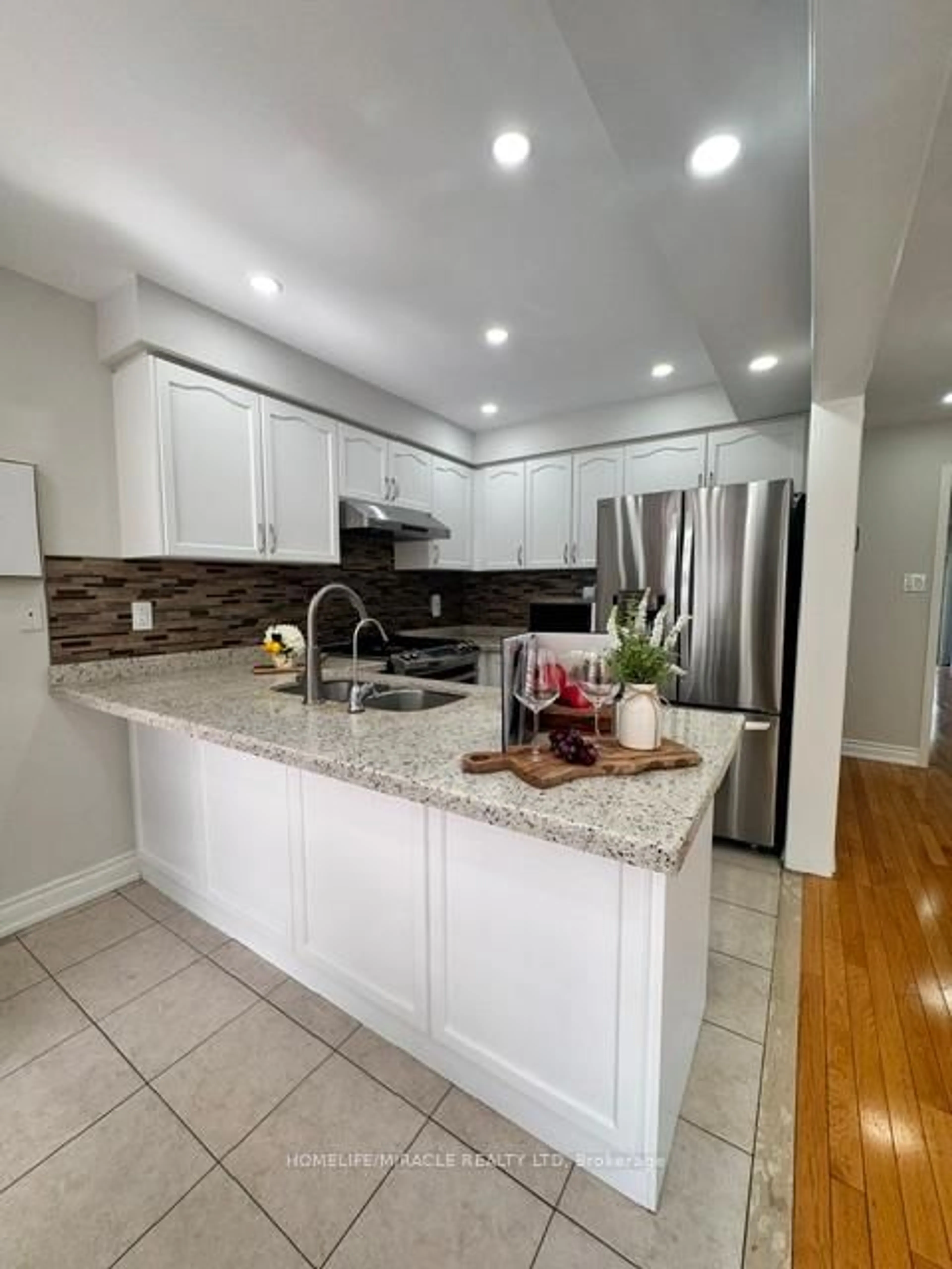 Open concept kitchen, ceramic/tile floor for 65 Bellchase Tr, Brampton Ontario L6P 3L9