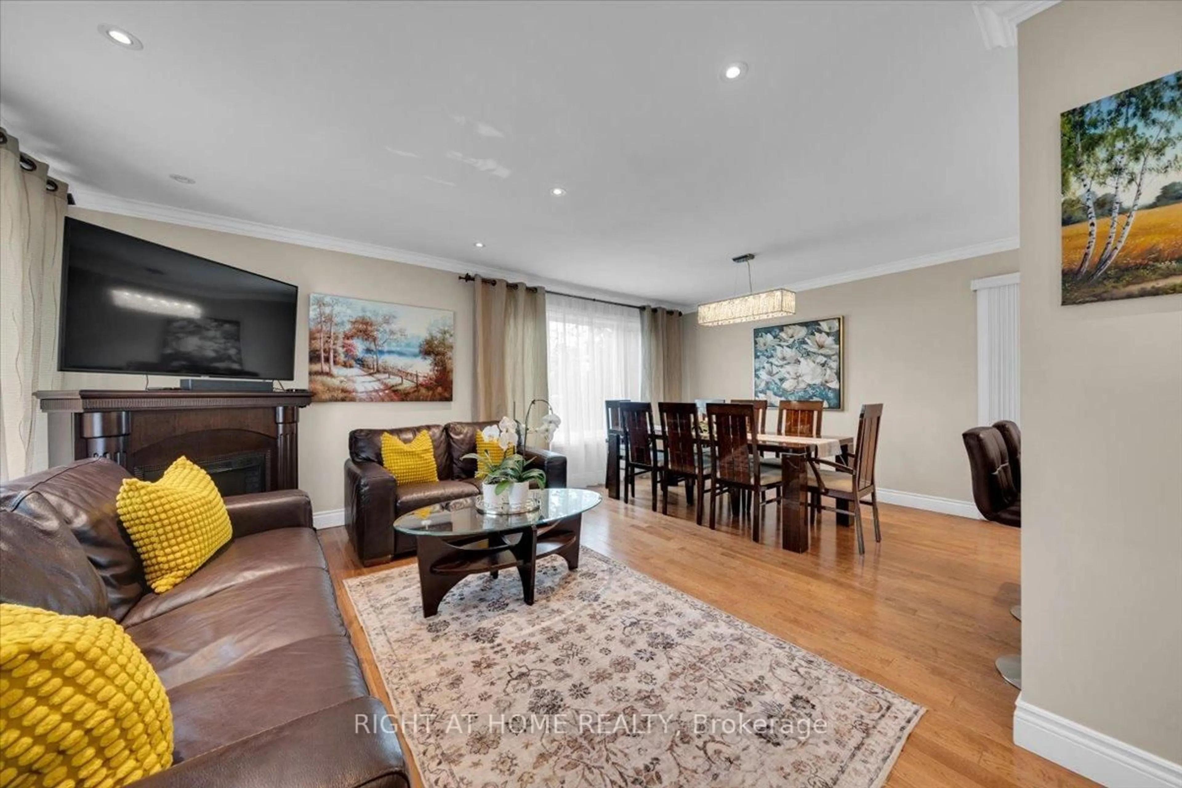 Living room with furniture, wood/laminate floor for 21 Warbeck Pl, Toronto Ontario M9R 3C2