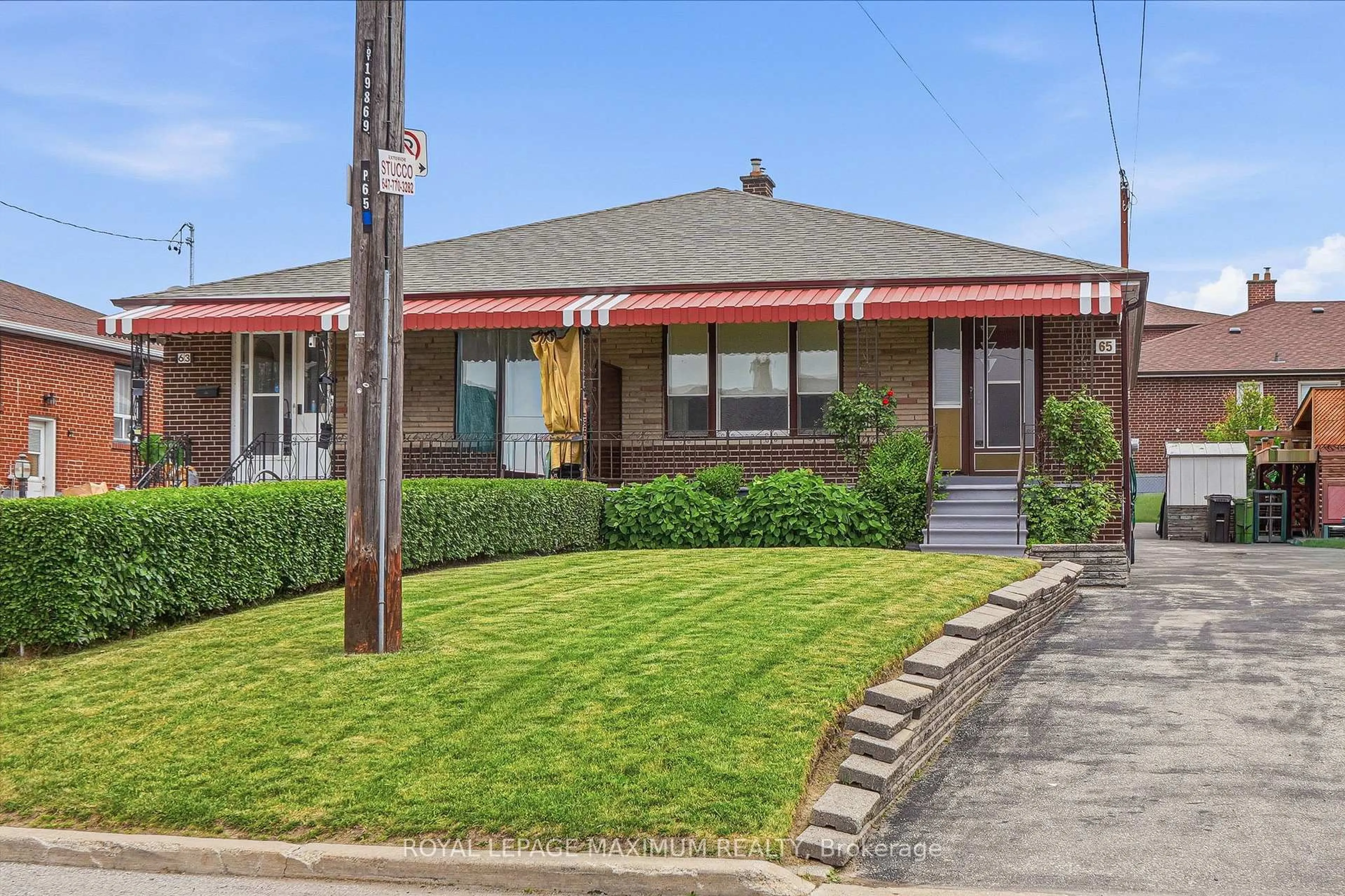 Home with brick exterior material, street for 65 Magellan Dr, Toronto Ontario M3L 1T4