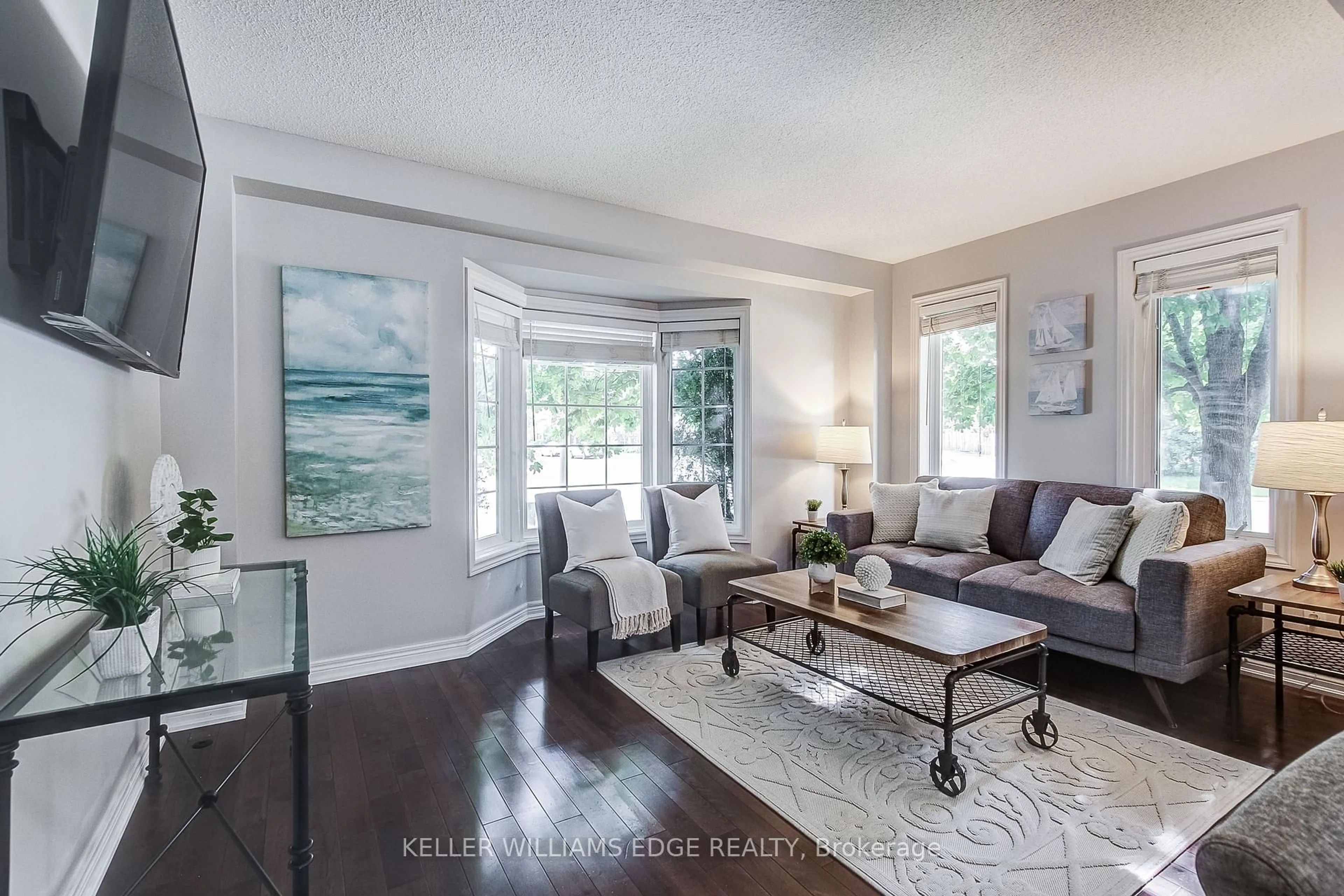 Living room with furniture, wood/laminate floor for 1749 Creek Way, Burlington Ontario L7L 7E1