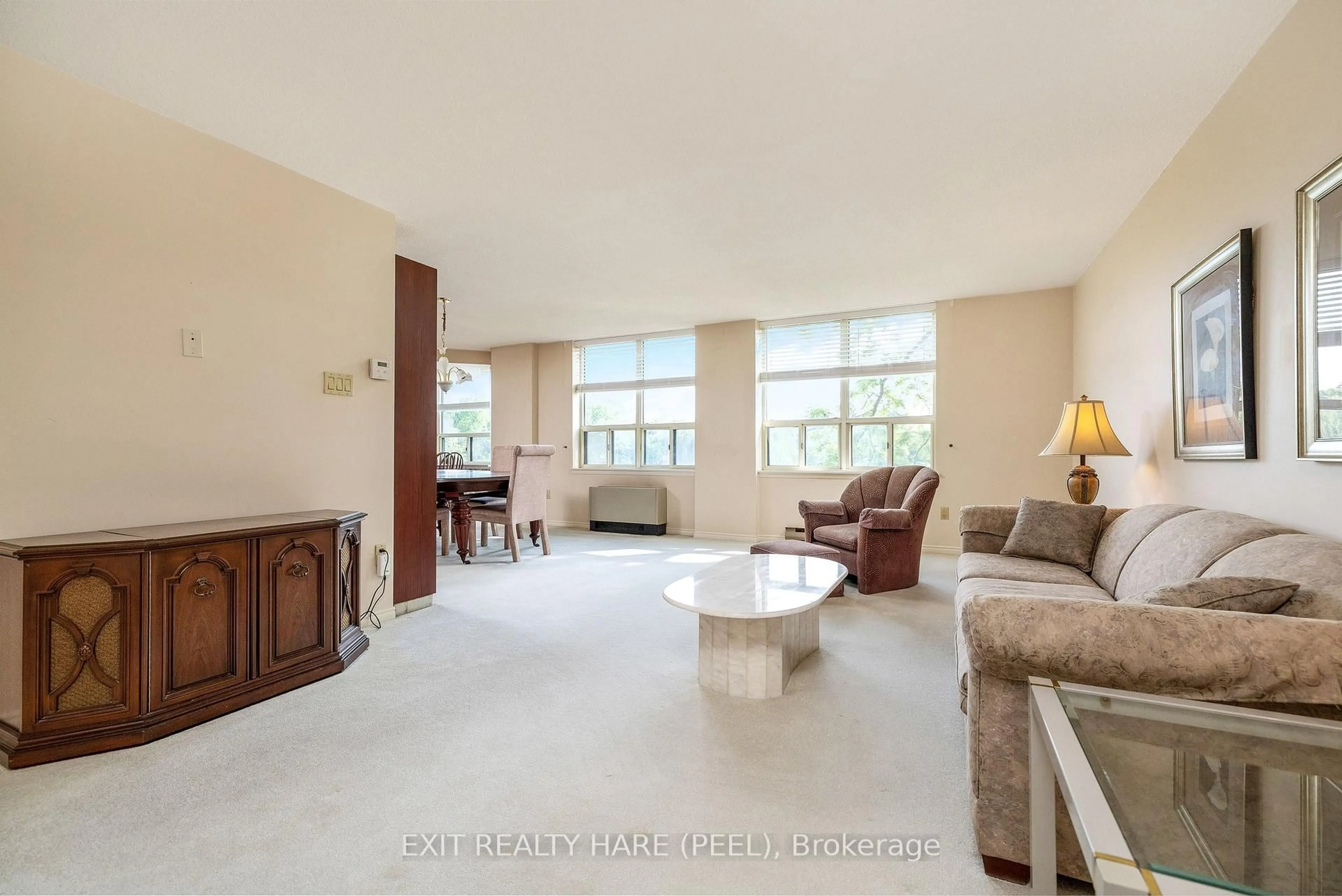 Living room with furniture, unknown for 58 Church St #203, Brampton Ontario L6V 4A8