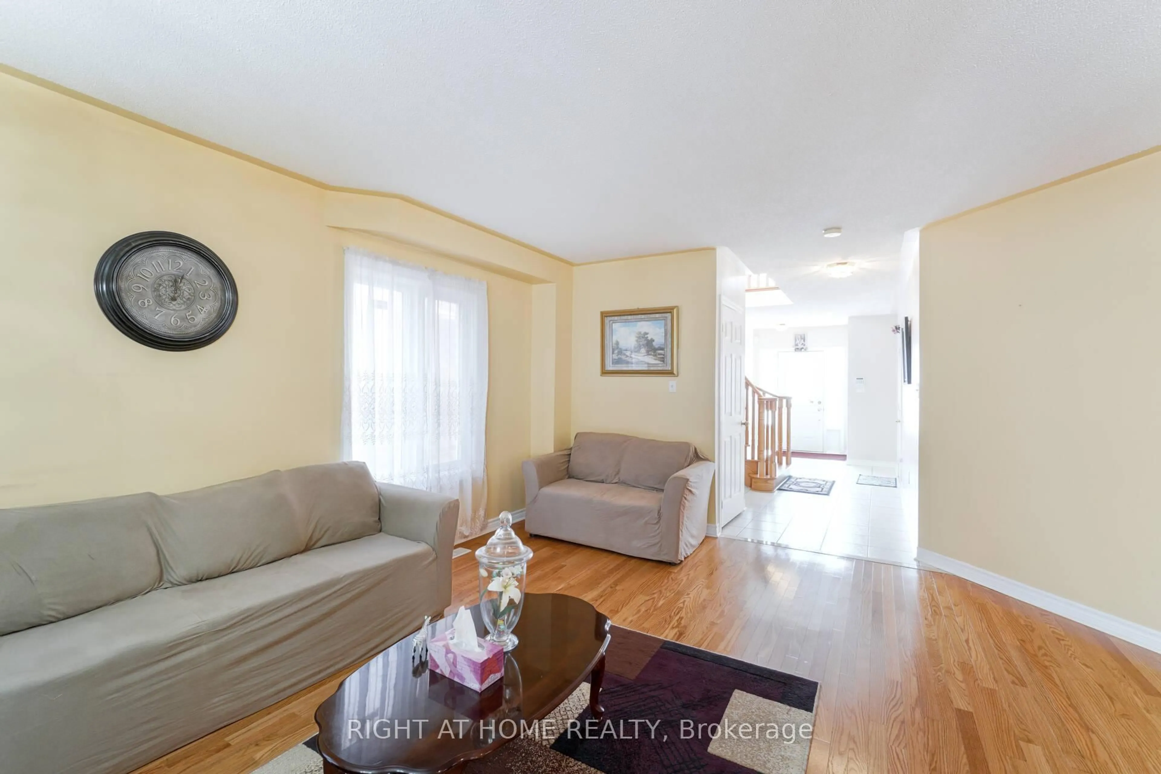 Living room with furniture, wood/laminate floor for 61 Sir Jacobs Cres, Brampton Ontario L7A 3T5