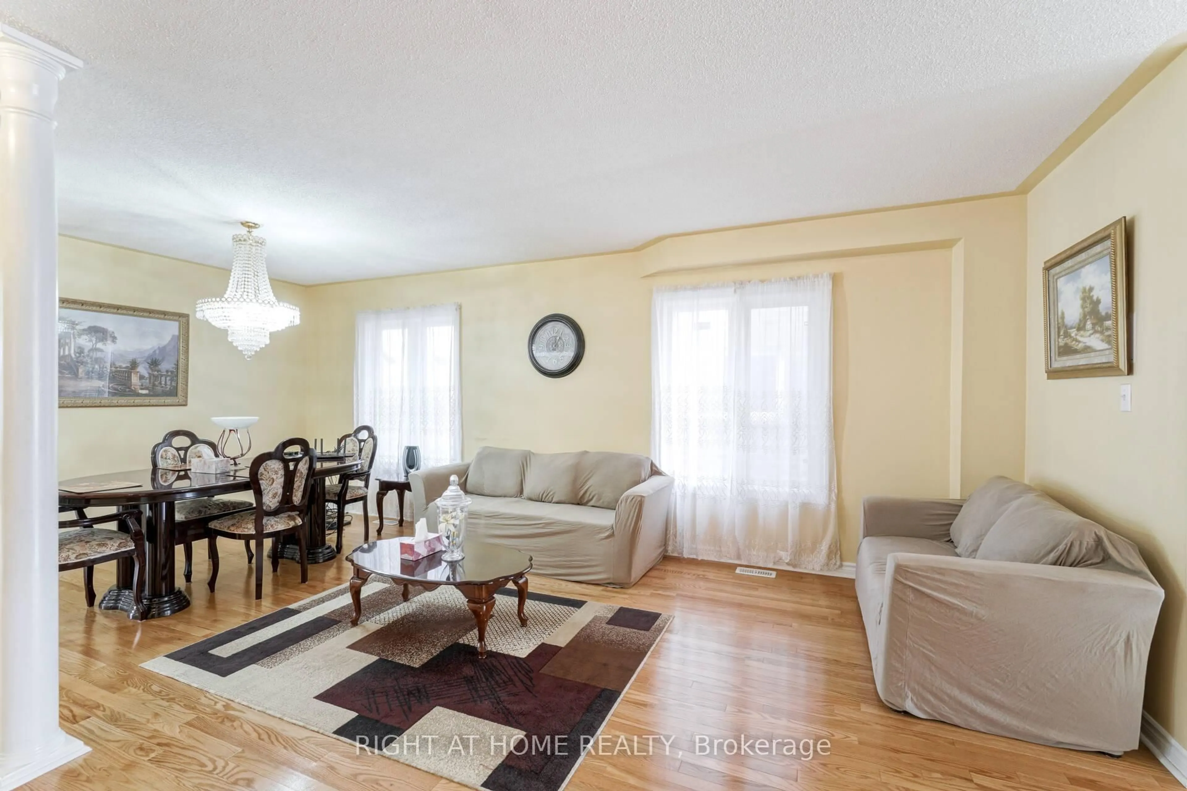 Living room with furniture, wood/laminate floor for 61 Sir Jacobs Cres, Brampton Ontario L7A 3T5