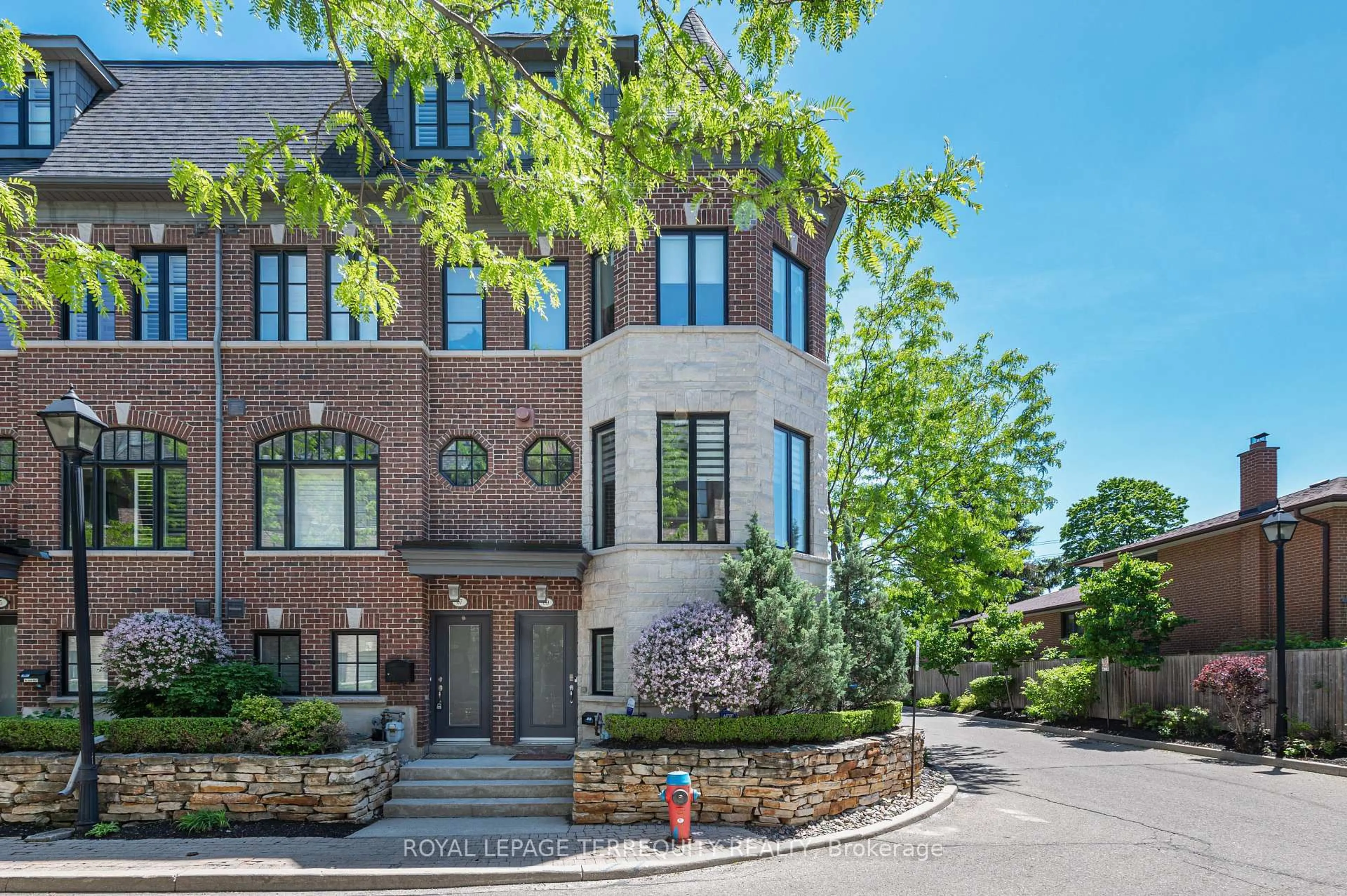 Home with brick exterior material, street for 69 Lobo Mews, Toronto Ontario M8Z 0B2