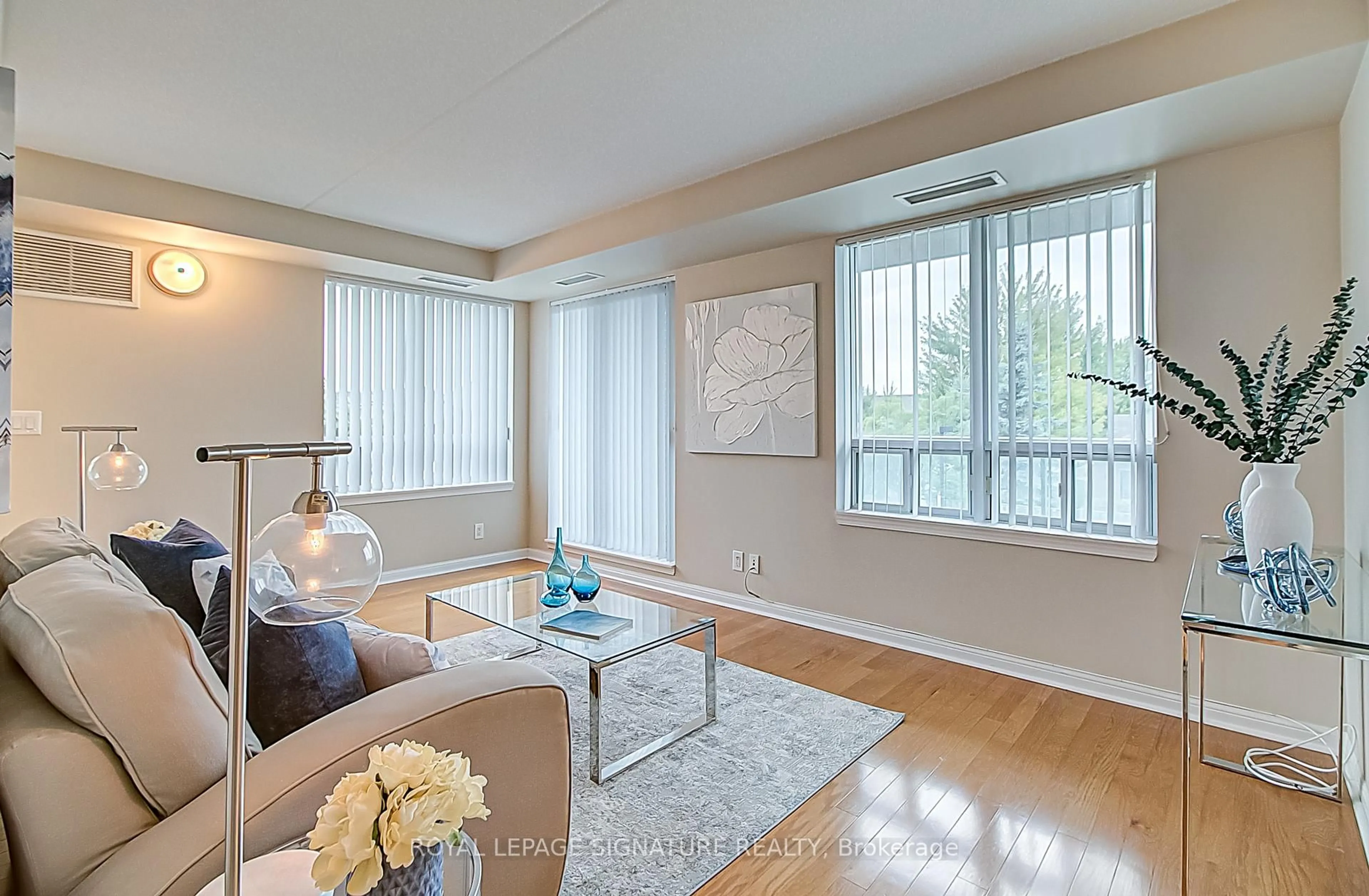 Living room with furniture, wood/laminate floor for 65 Via Rosedale #214, Brampton Ontario L6R 3N8