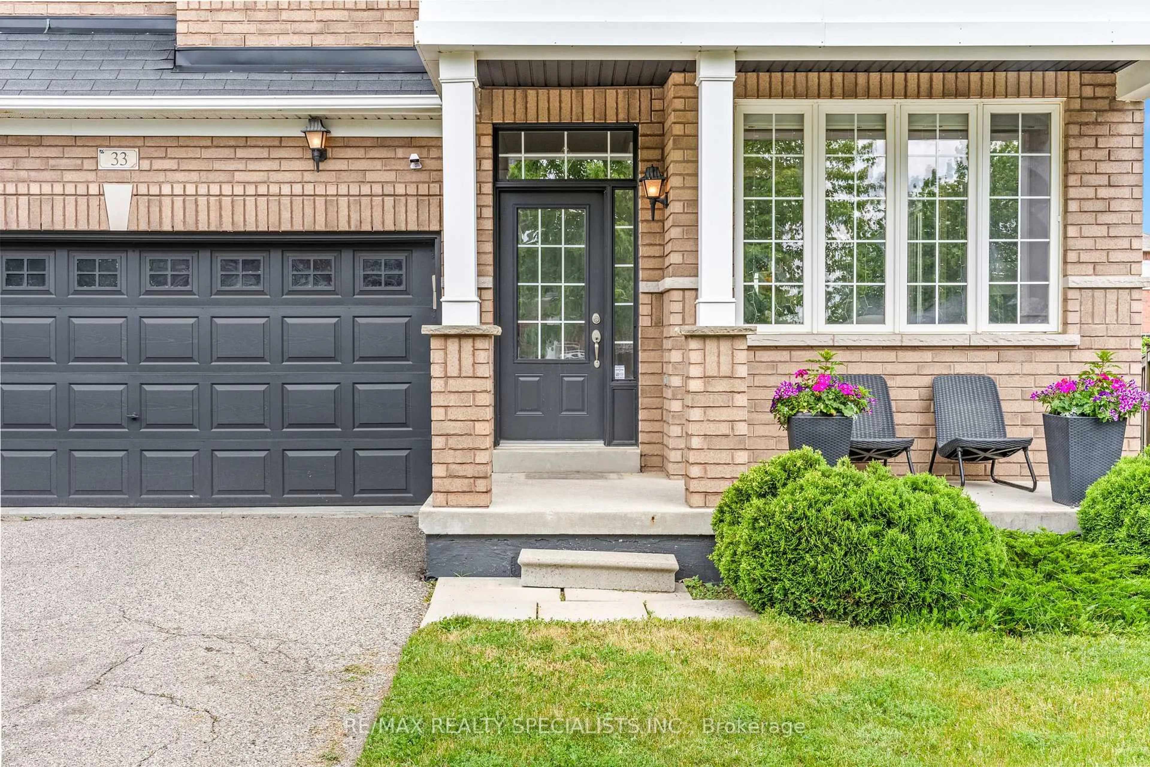 Home with brick exterior material, street for 33 Delphinium Way, Brampton Ontario L7A 0N4