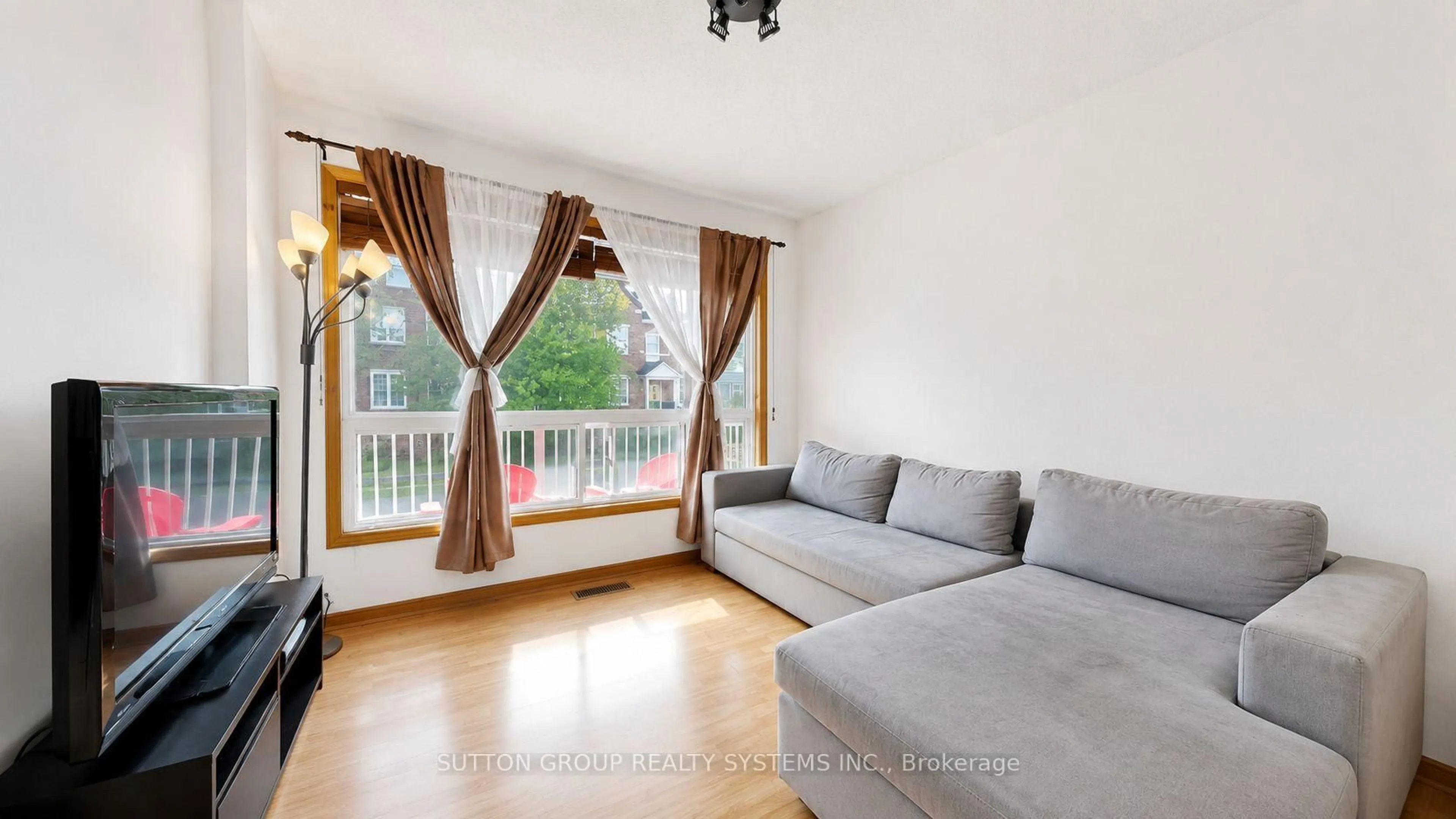 Living room with furniture, wood/laminate floor for 289D Bartlett Ave, Toronto Ontario M6H 3G3