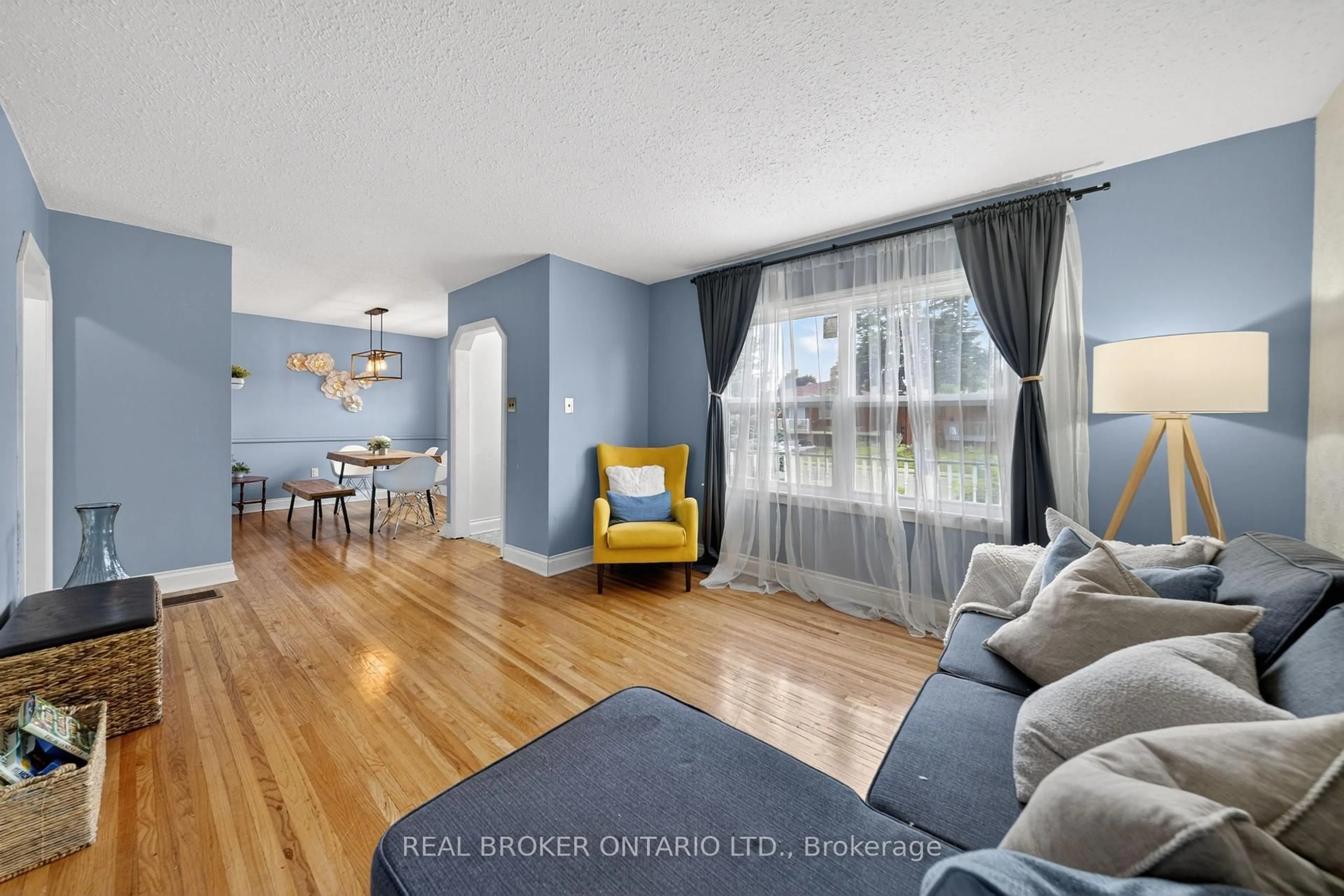 Living room with furniture, wood/laminate floor for 67 Archibald St, Brampton Ontario L6X 1M3