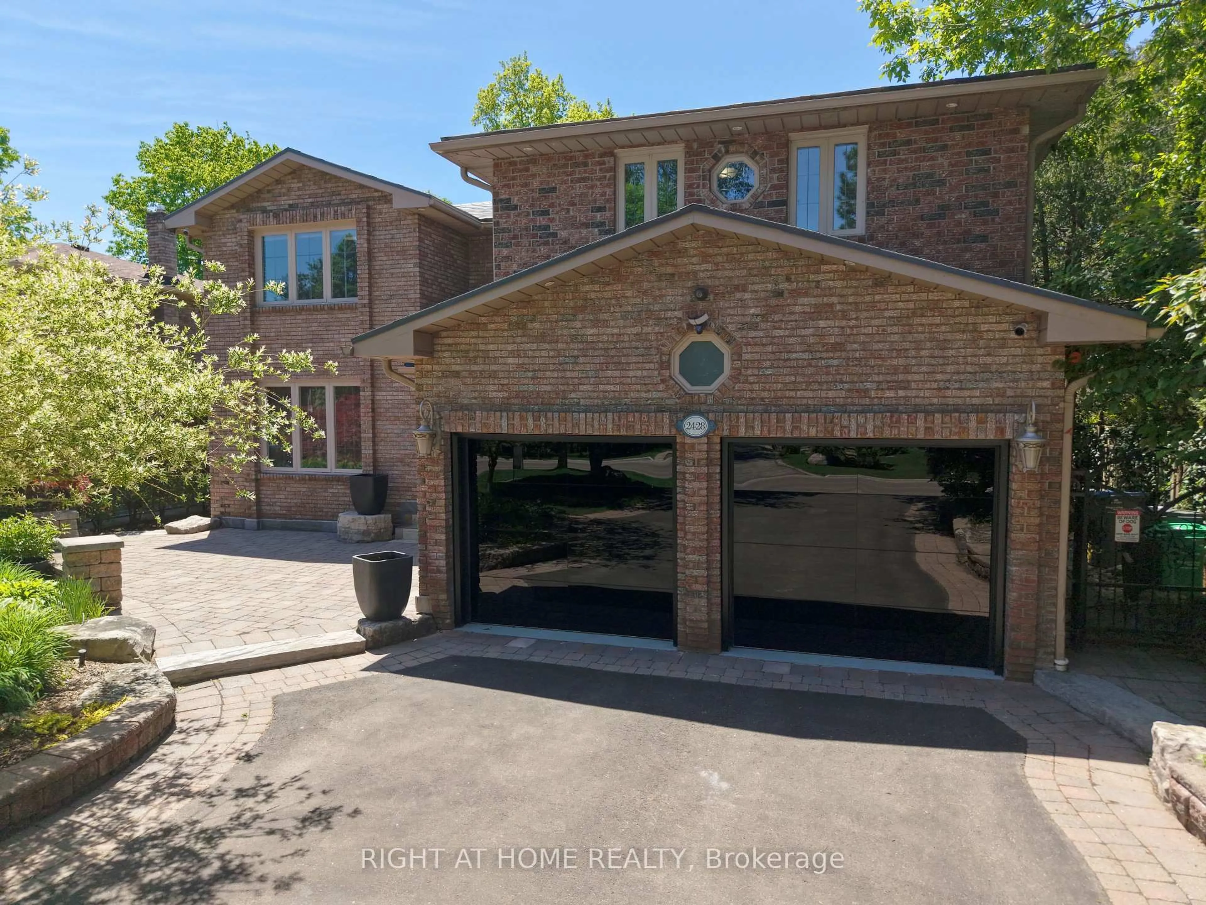 Home with brick exterior material, street for 2428 Old Carriage Rd, Mississauga Ontario L5C 3G4