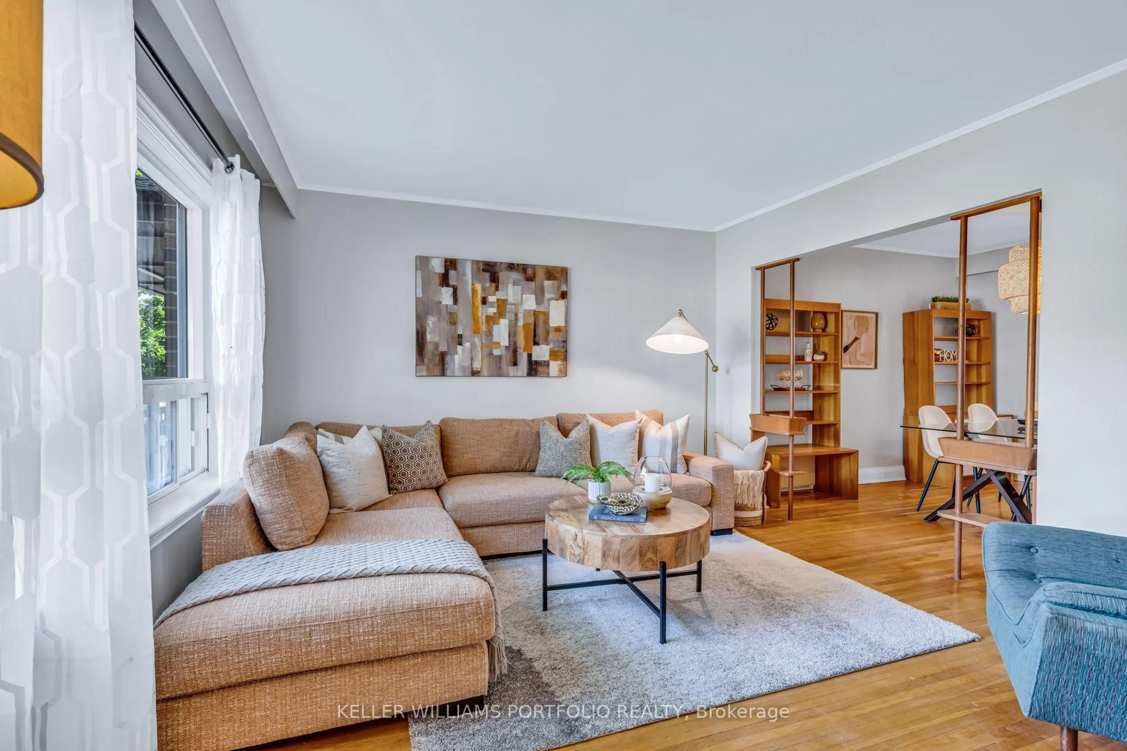Living room with furniture, wood/laminate floor for 210 Bicknell Ave, Toronto Ontario M6M 4G9