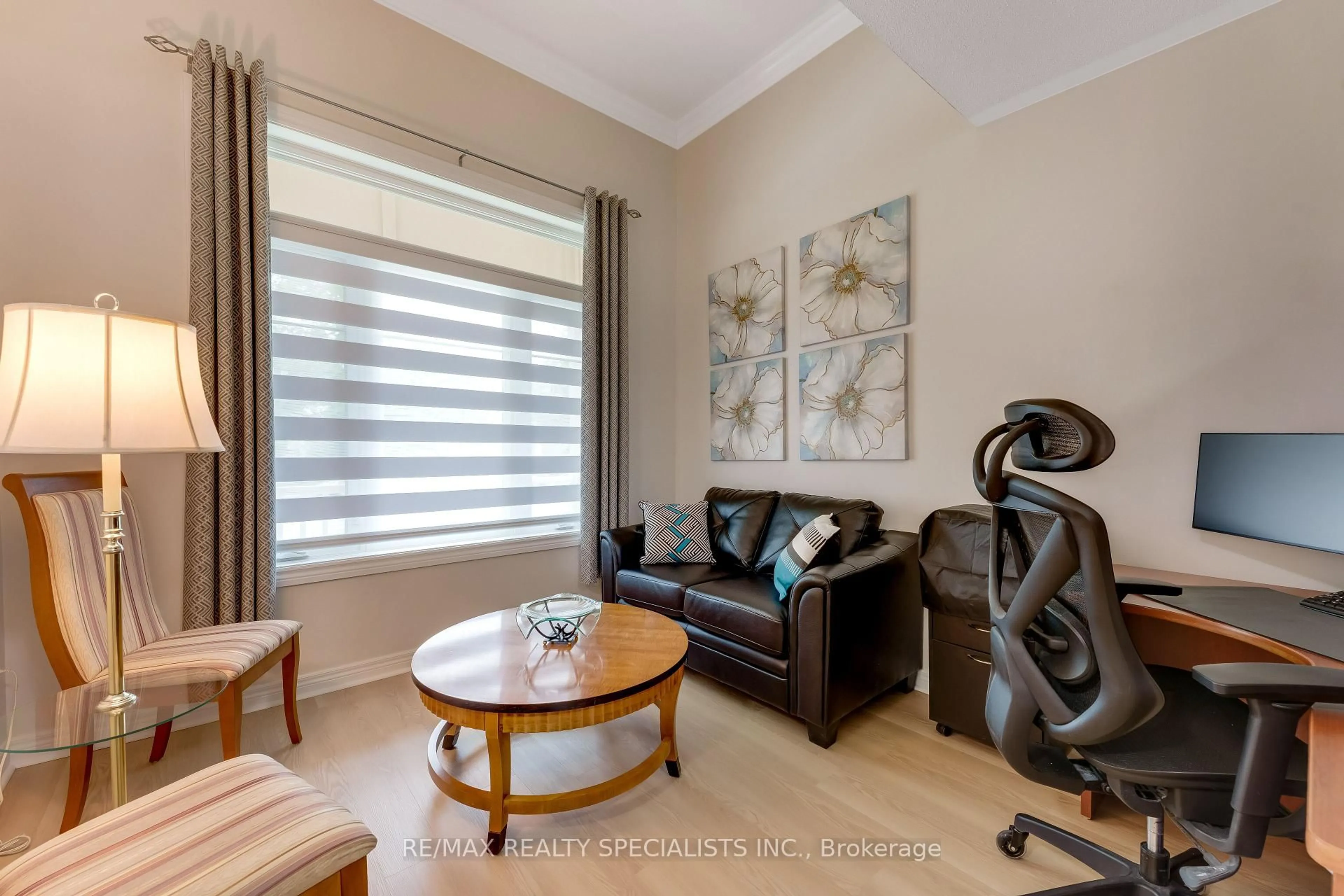 Living room with furniture, wood/laminate floor for 54 Red Plant Cres, Brampton Ontario L7A 1V8