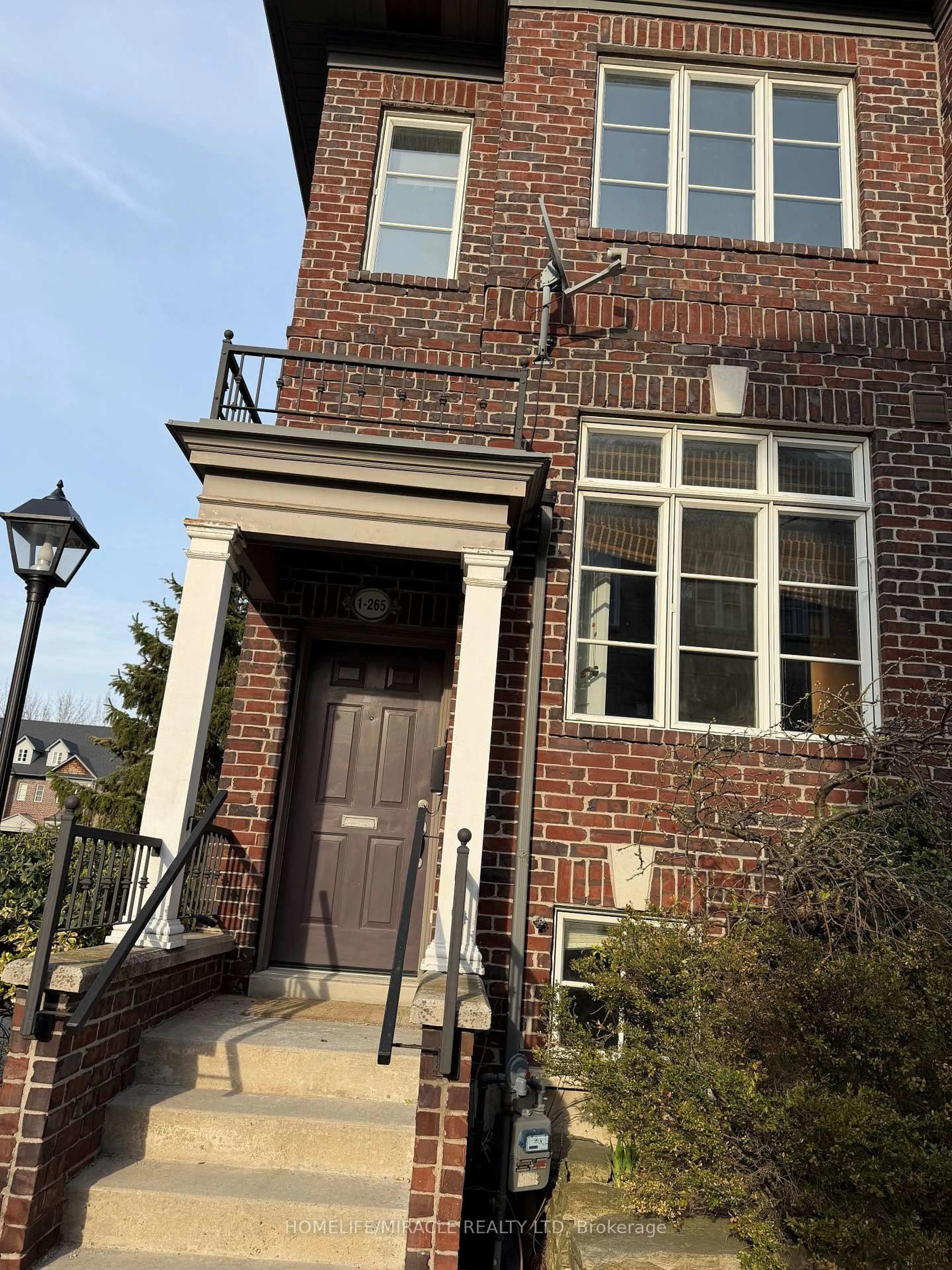 Home with brick exterior material, street for 265 Van Dusen Blvd #1, Toronto Ontario M8Z 3J2