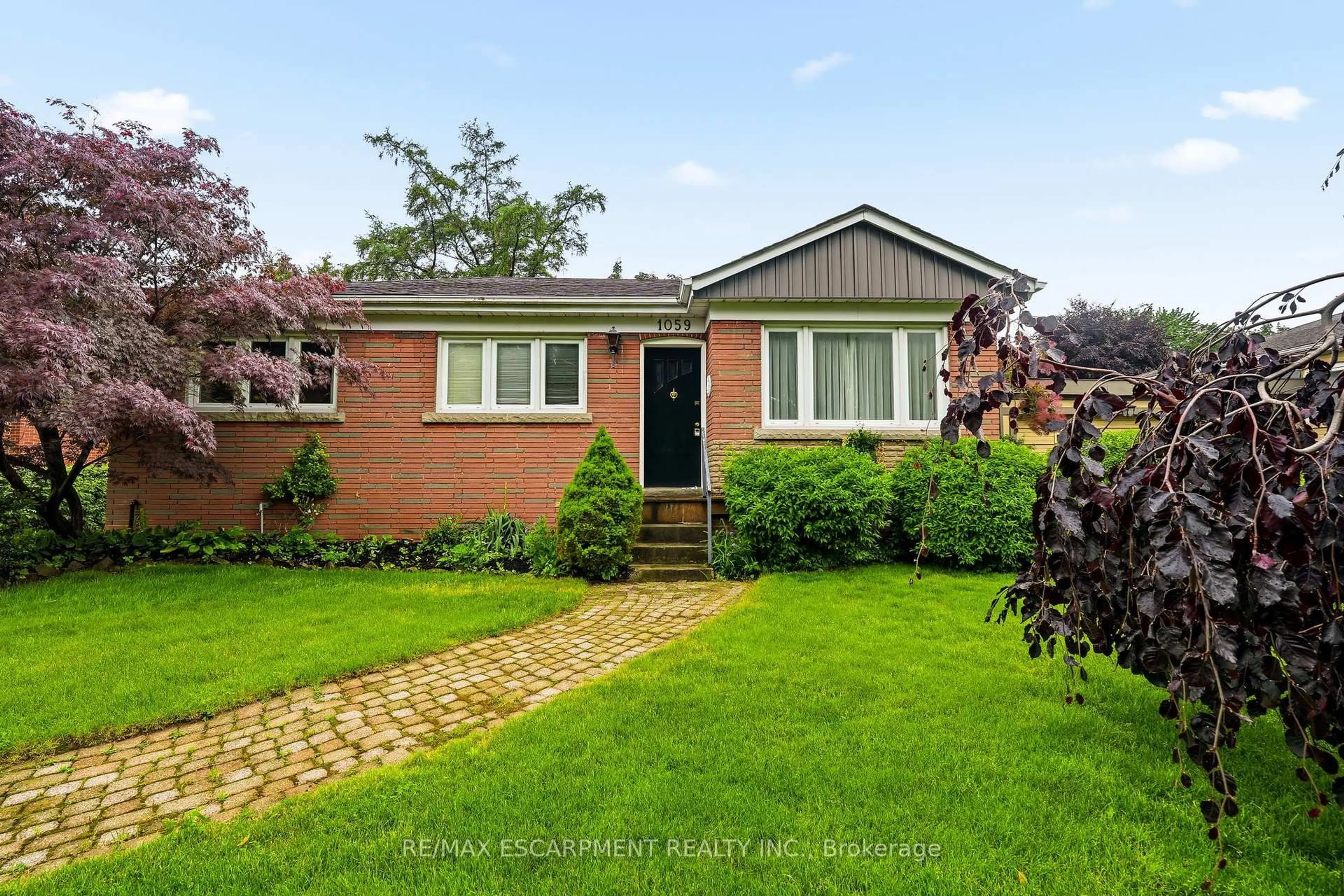 Home with brick exterior material, street for 1059 SHEPHERDS Dr, Burlington Ontario L7T 3R4