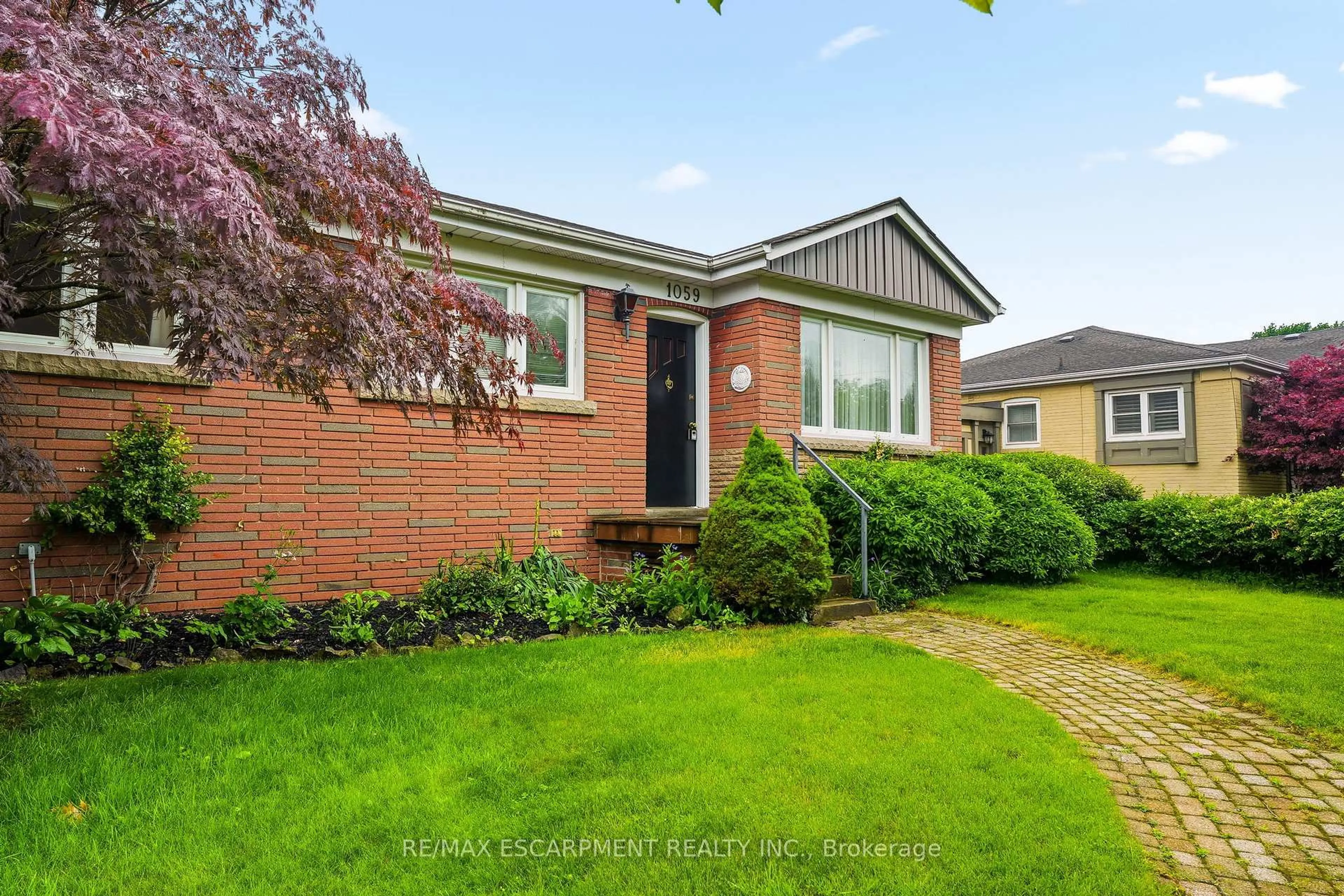 Home with brick exterior material, street for 1059 SHEPHERDS Dr, Burlington Ontario L7T 3R4
