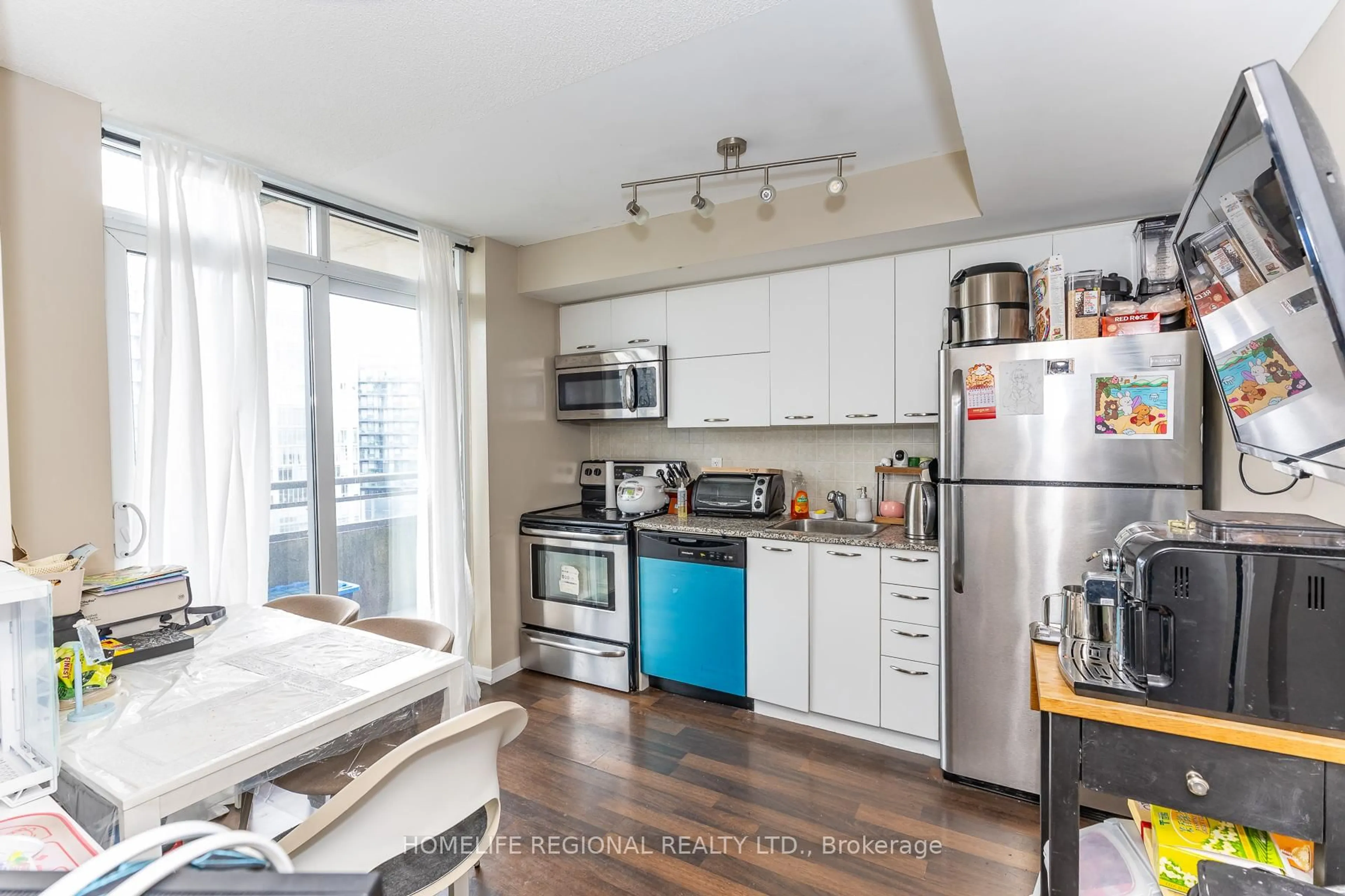 Open concept kitchen, unknown for 38 Joe Shuster Way #1520, Toronto Ontario M6K 0A5