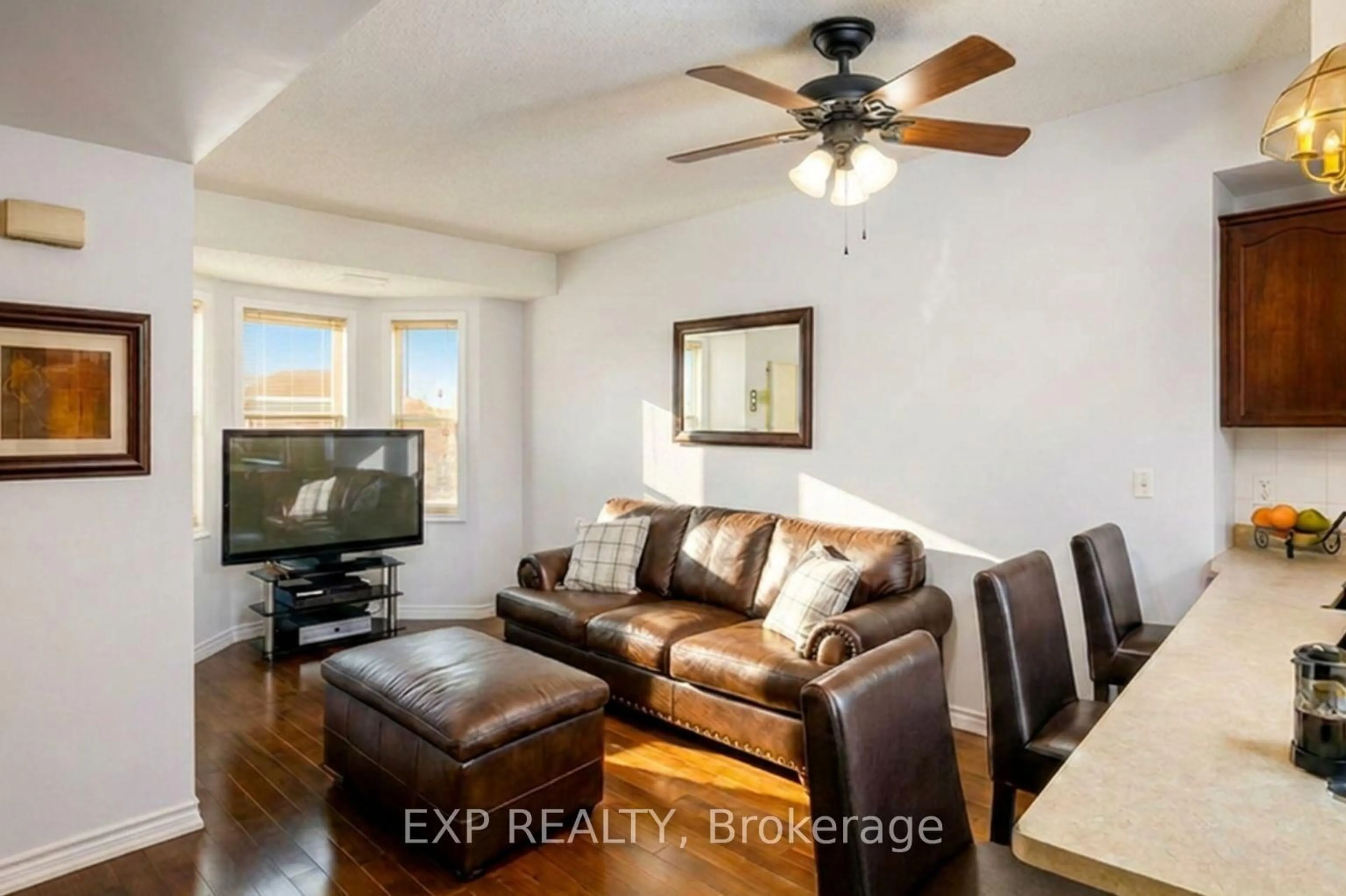 Living room with furniture, wood/laminate floor for 760 Lawrence Ave #132, Toronto Ontario M6A 3E7
