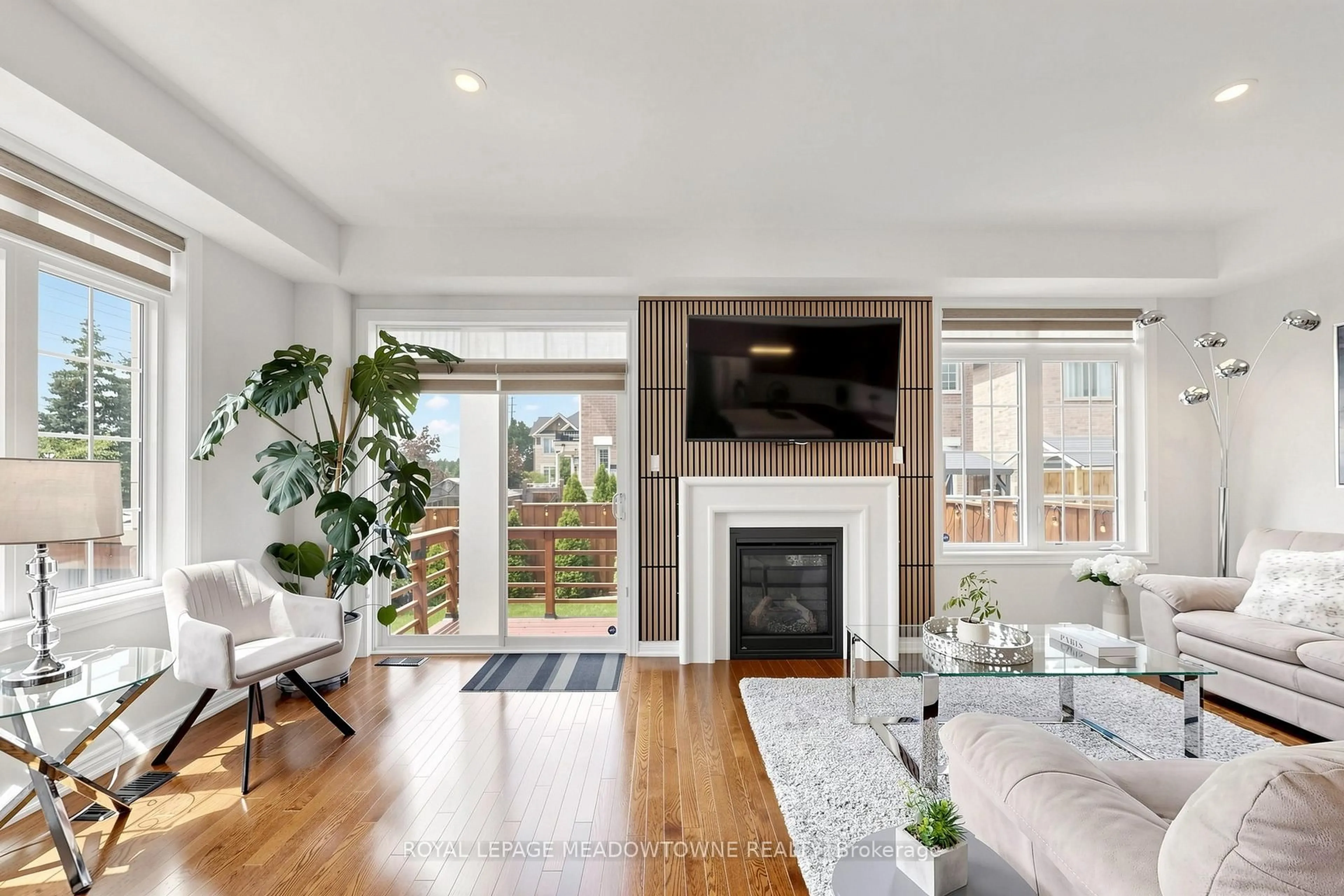 Living room with furniture, wood/laminate floor for 3892 Arvona Pl, Mississauga Ontario L5M 0Y5