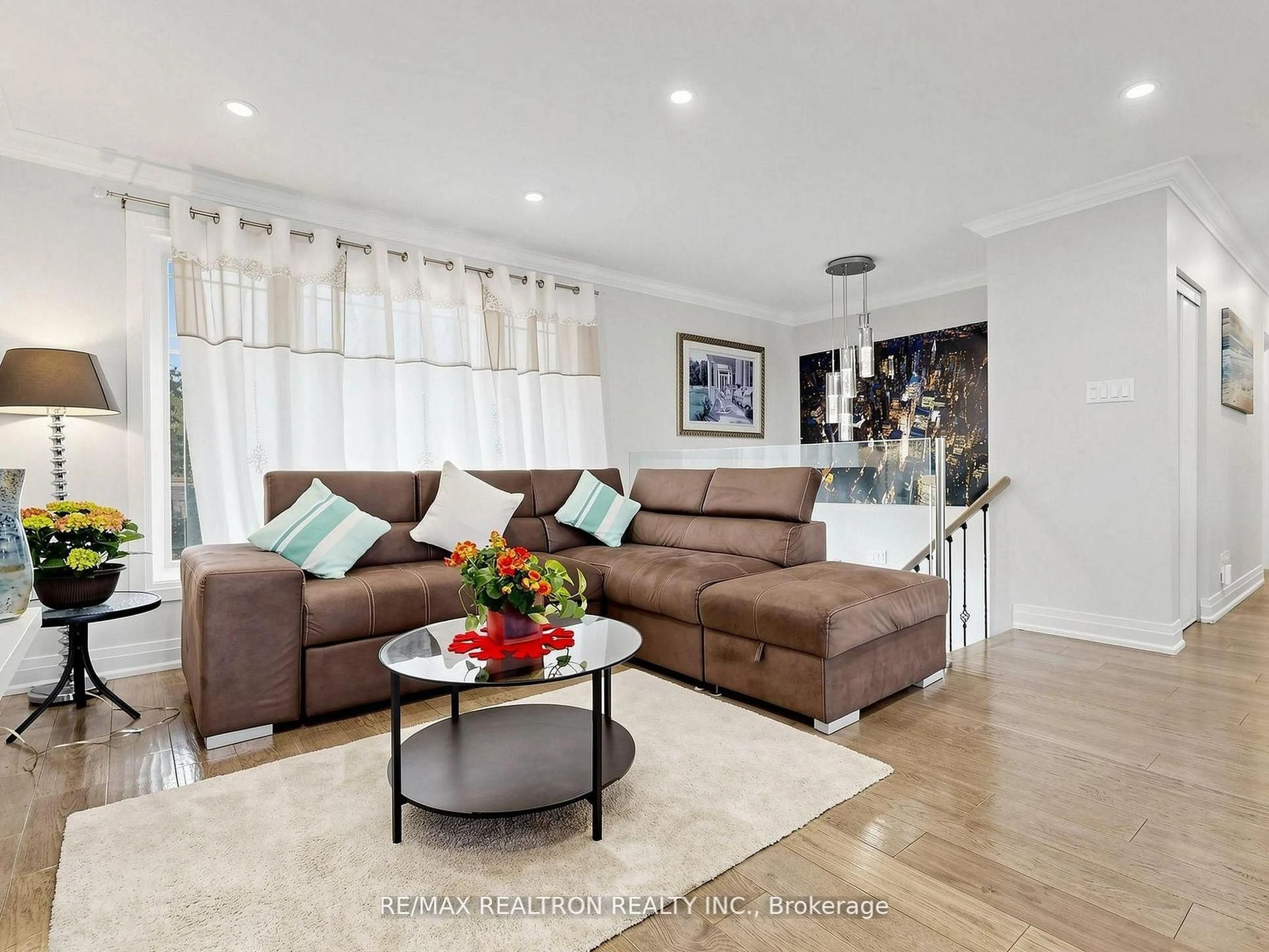 Living room with furniture, wood/laminate floor for 56 Candlewood Cres, Toronto Ontario M3J 1G8