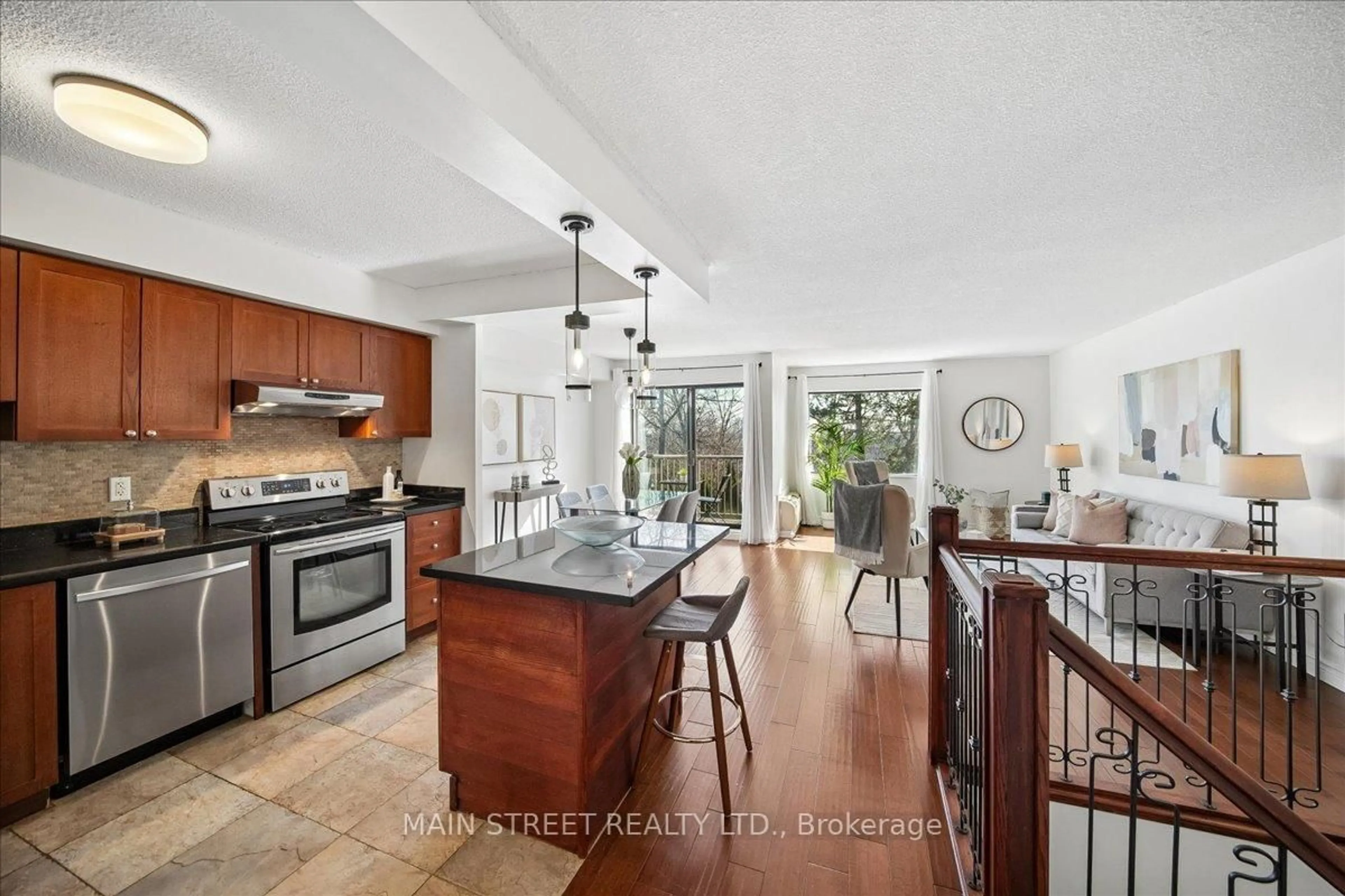 Open concept kitchen, ceramic/tile floor for 1000 Cedarglen Gate #217, Mississauga Ontario L5C 3Z5