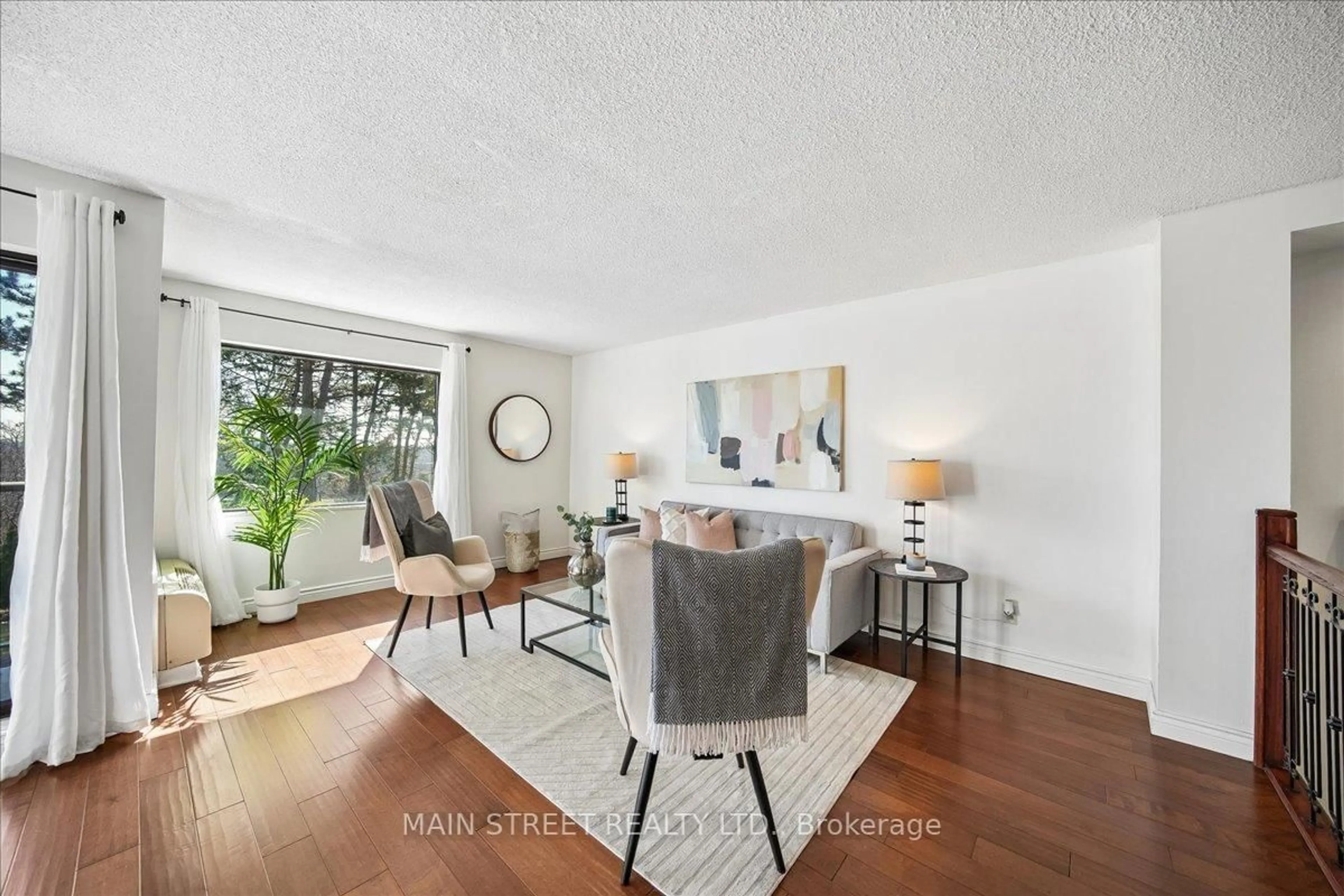 Living room with furniture, unknown for 1000 Cedarglen Gate #217, Mississauga Ontario L5C 3Z5