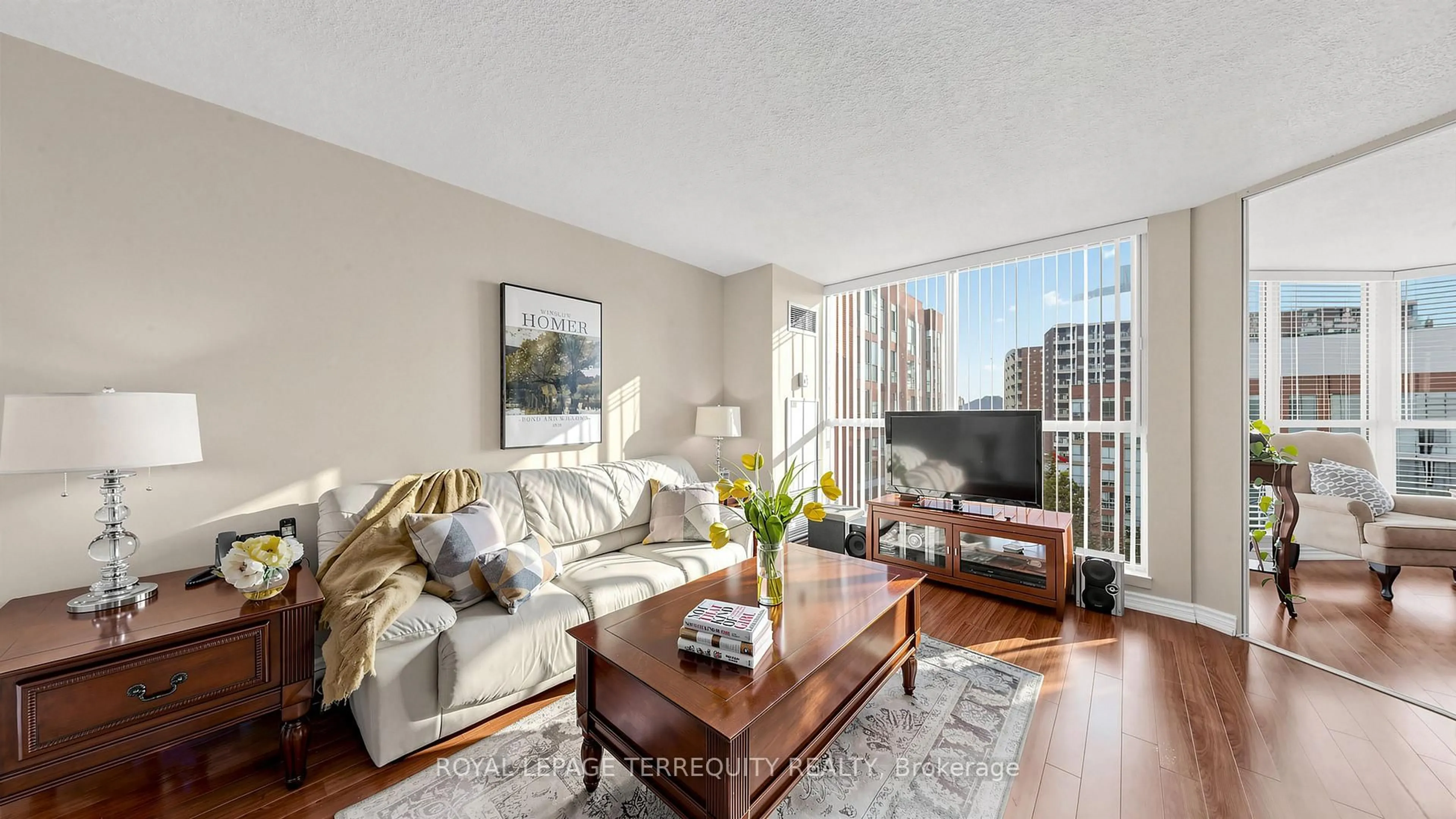 Living room with furniture, wood/laminate floor for 22 Southport St #833, Toronto Ontario M6S 4Y9