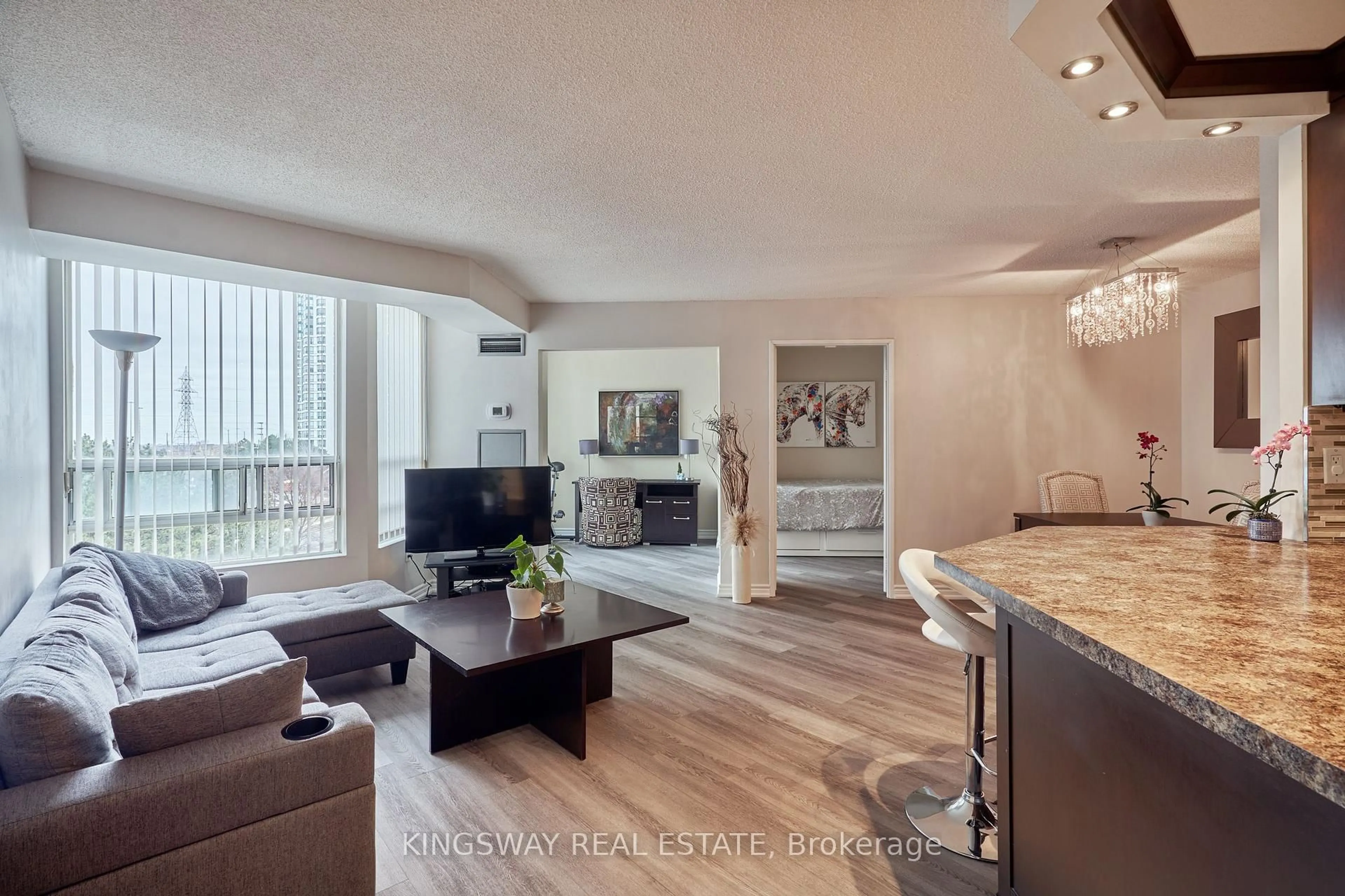 Living room with furniture, wood/laminate floor for 50 Kingsbridge Garden Circ #510, Mississauga Ontario L5R 1Y2