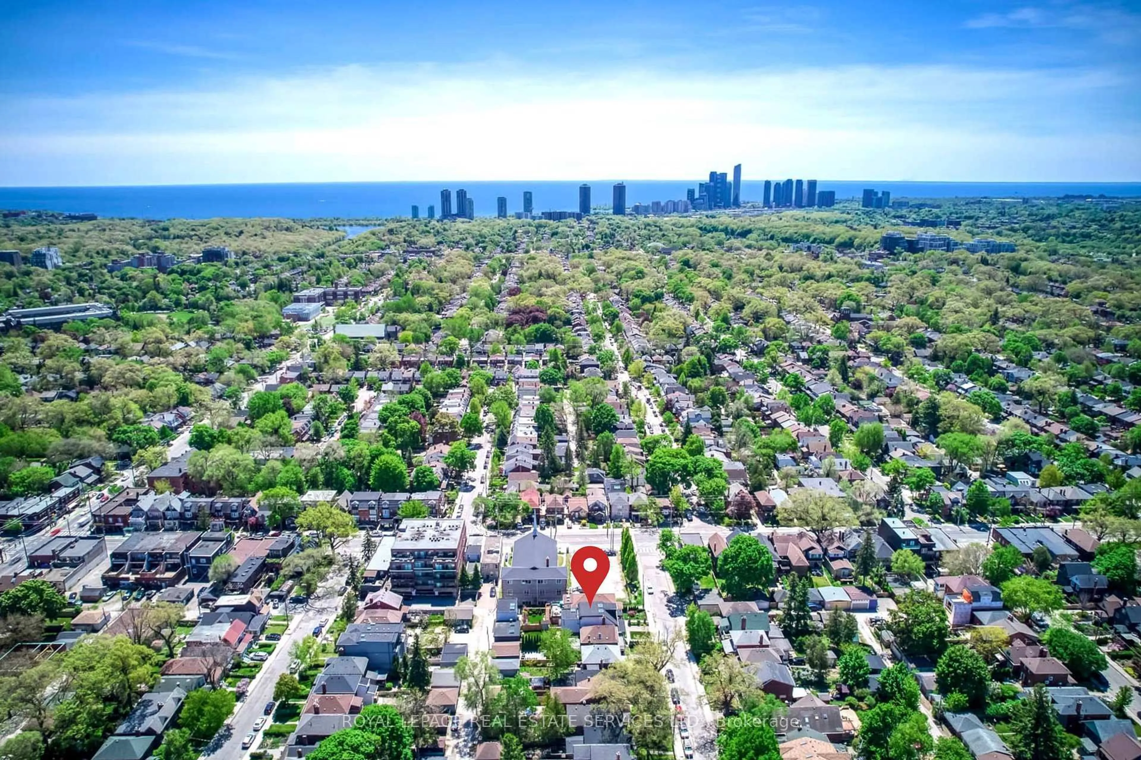A pic from outside/outdoor area/front of a property/back of a property/a pic from drone, street for 561 Durie St, Toronto Ontario M6S 3H2