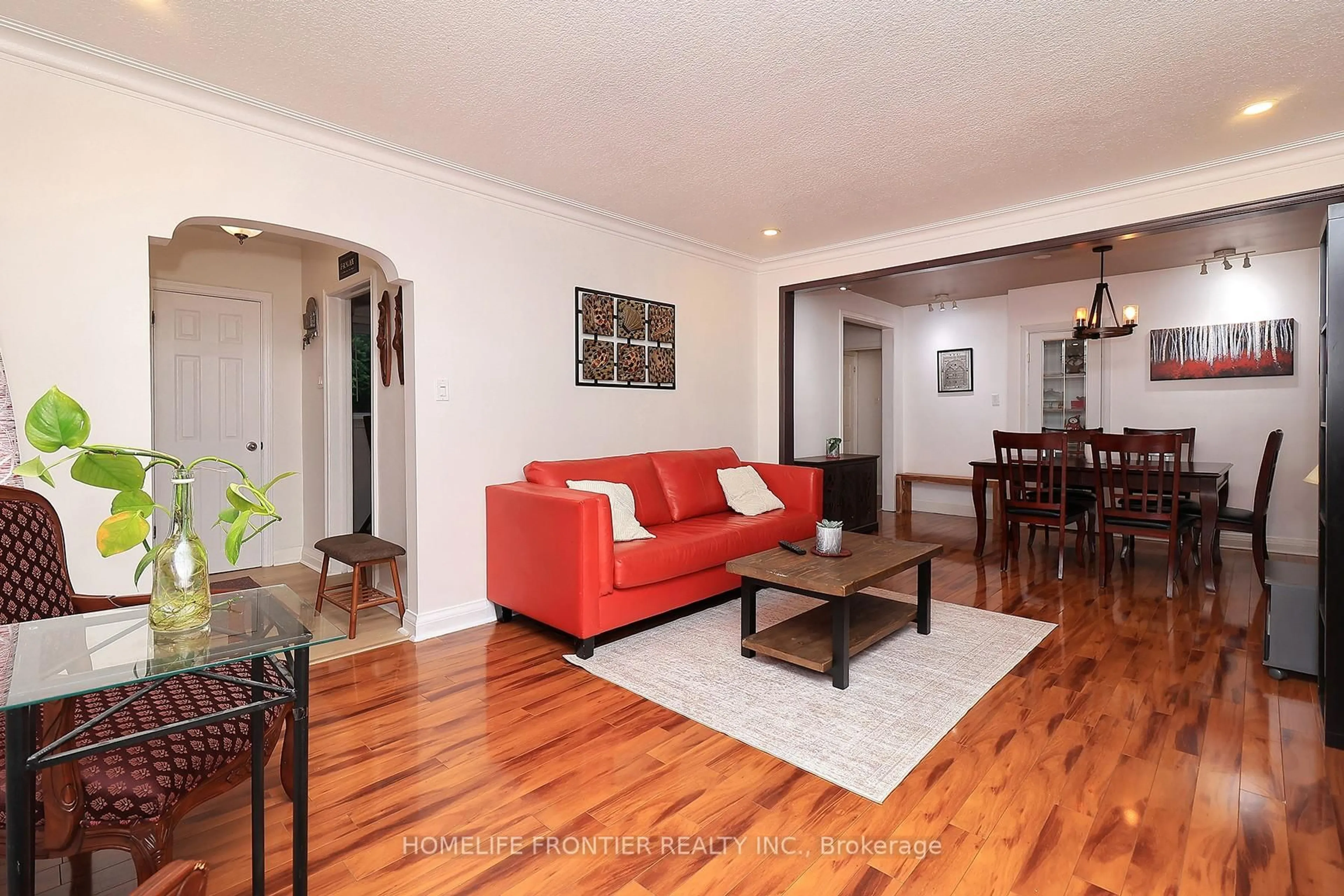 Living room with furniture, wood/laminate floor for 32 Coules Crt, Toronto Ontario M8W 2N9